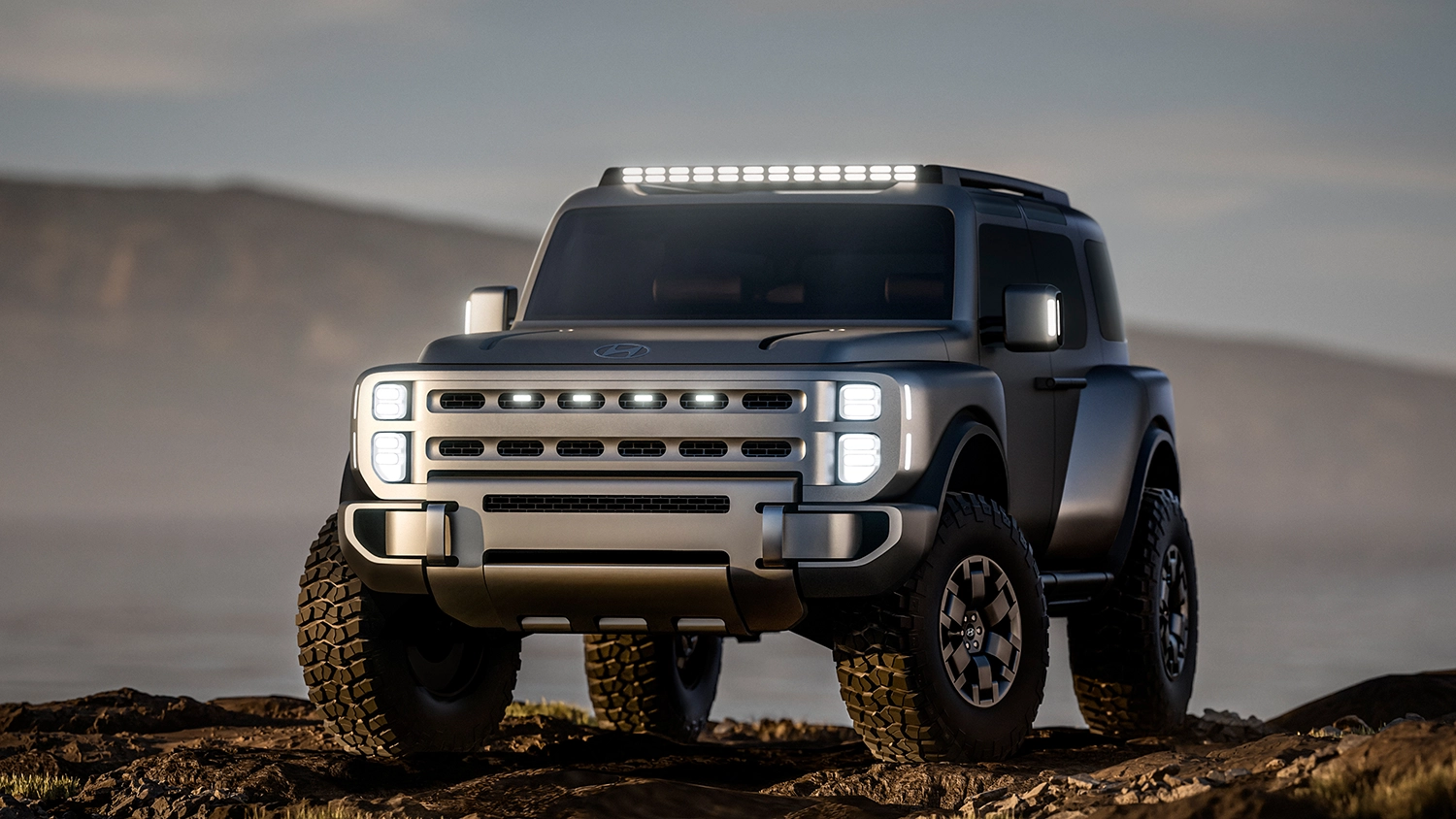 Low-angle front view of the Hyundai Boulder Concept emphasizing its suspension and tires.