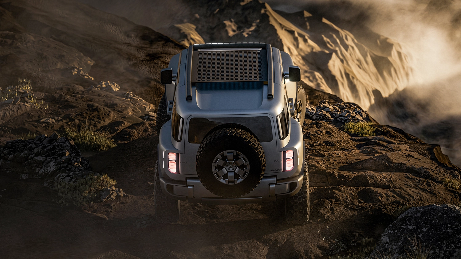 Overhead rear view of the Hyundai Boulder Concept navigating a steep mountain trail.