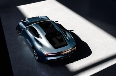 Top-down view of the Lynk & Co GT concept in Apex Blue, showcasing the glass roof and streamlined aerodynamic silhouette.