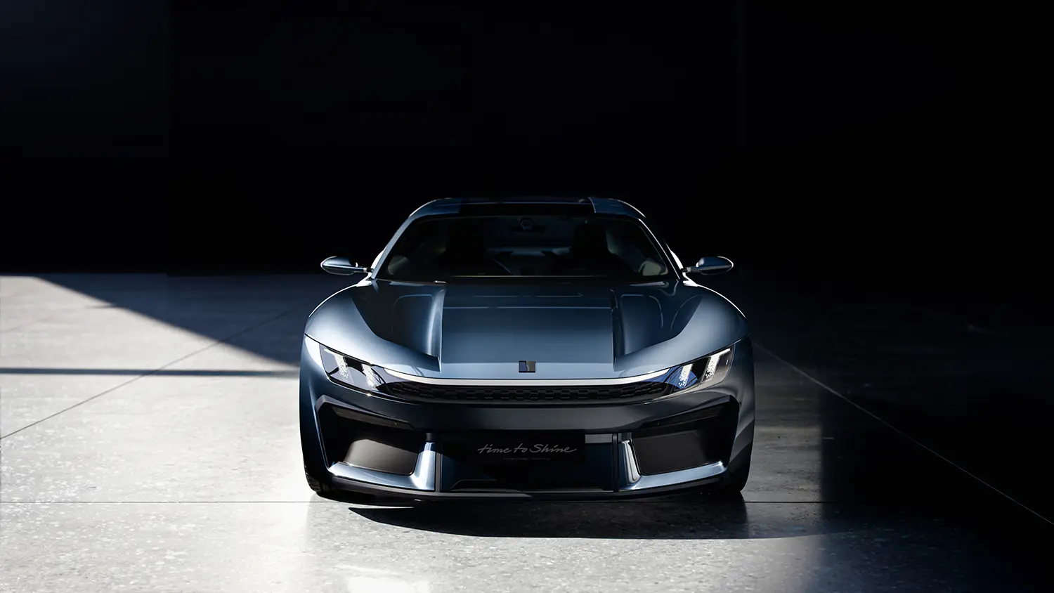 Symmetrical front view of the Lynk & Co GT concept featuring a minimalist LED light bar and aggressive lower air intakes.