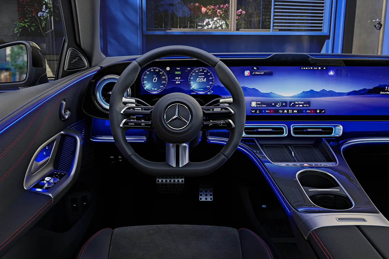 Close-up from the driver’s perspective showing the sports steering wheel and the digital instrument cluster.