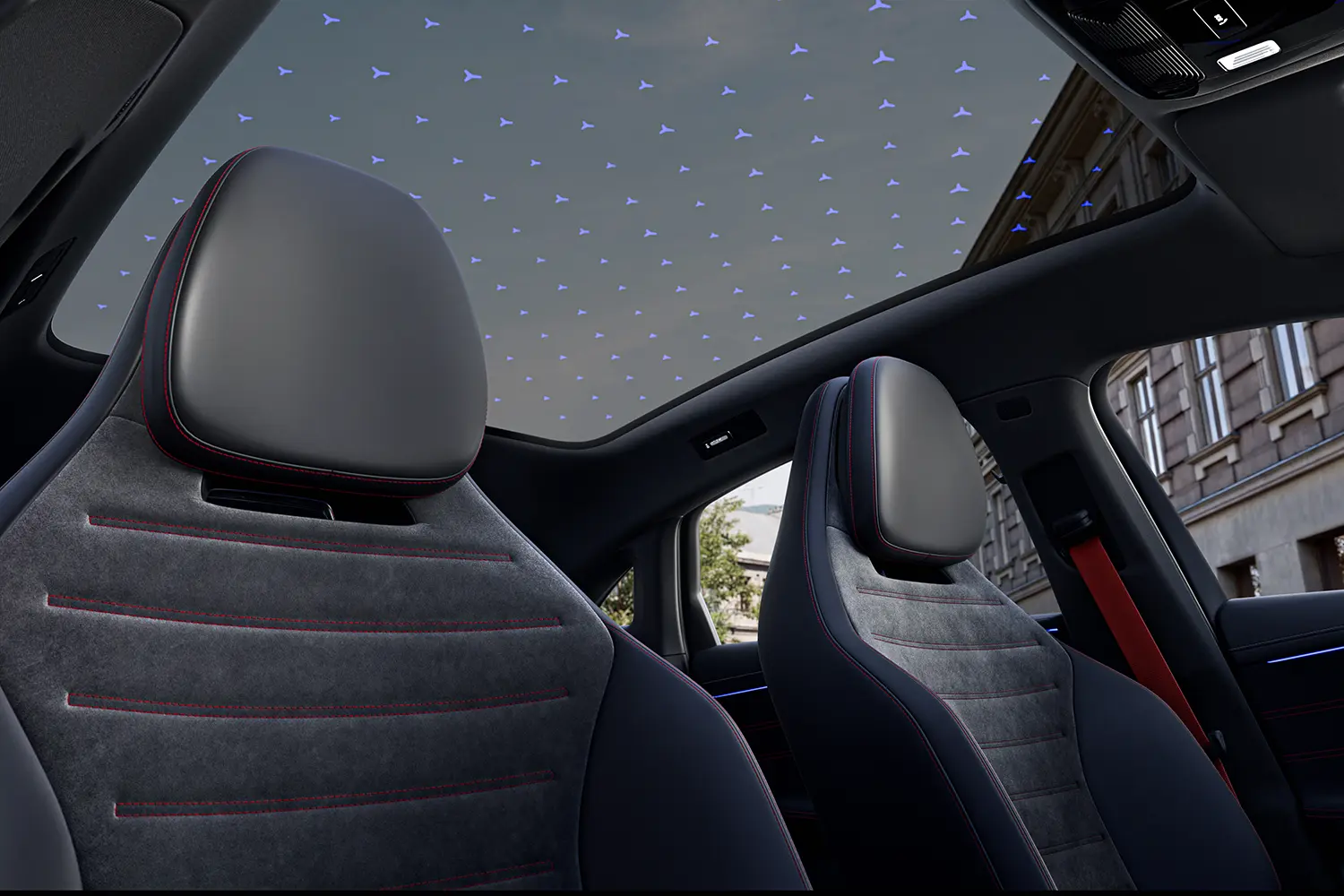 Low-angle view looking up at the panoramic roof with an illuminated Mercedes-Benz star pattern.