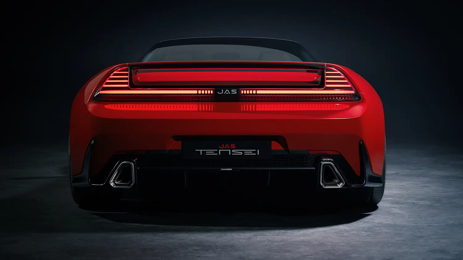 Direct rear view of the red Tensei supercar showing the JAS Tensei branding and dual exhausts.