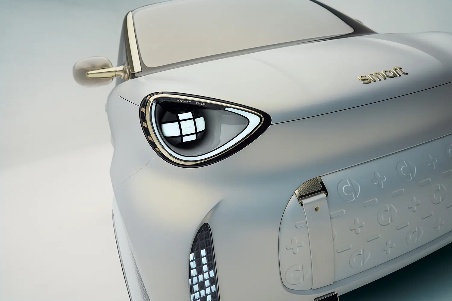 Detail shot of the smart Concept #2 headlight and textured front fascia with leather strap accents.