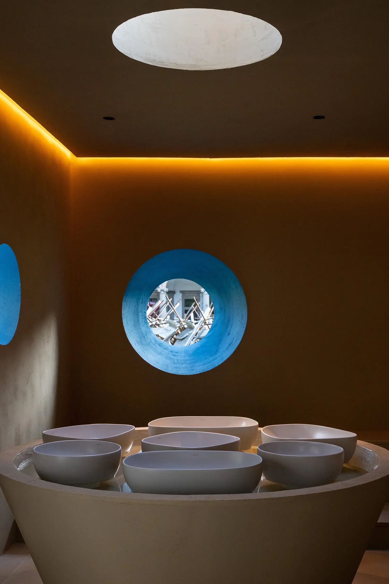 Close-up of the internal ceramic basin and the view out the blue-ringed oculus.