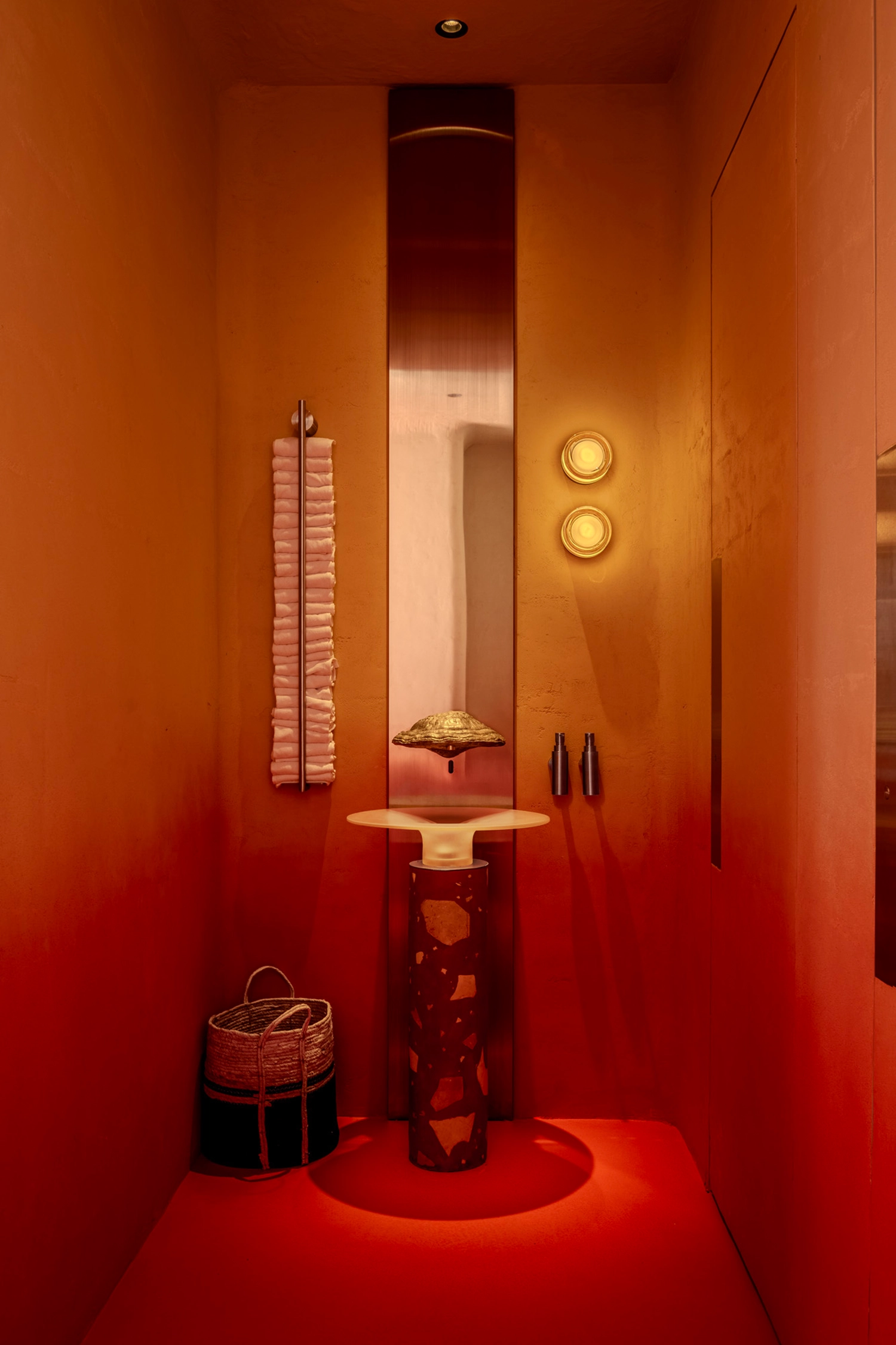 Bathroom interior with a chaga mushroom-shaped faucet and red gradient walls.