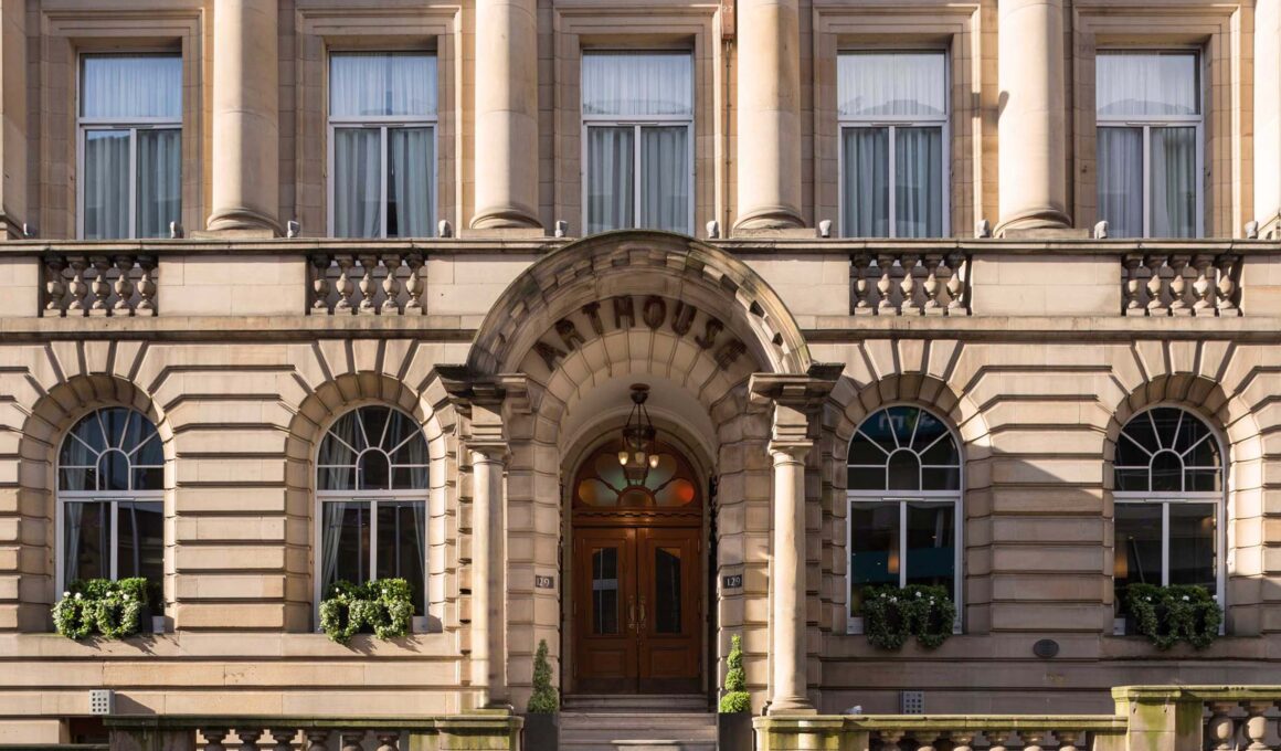 Neoclassical facade of Arthouse Glasgow featuring arched windows and stone pillars.