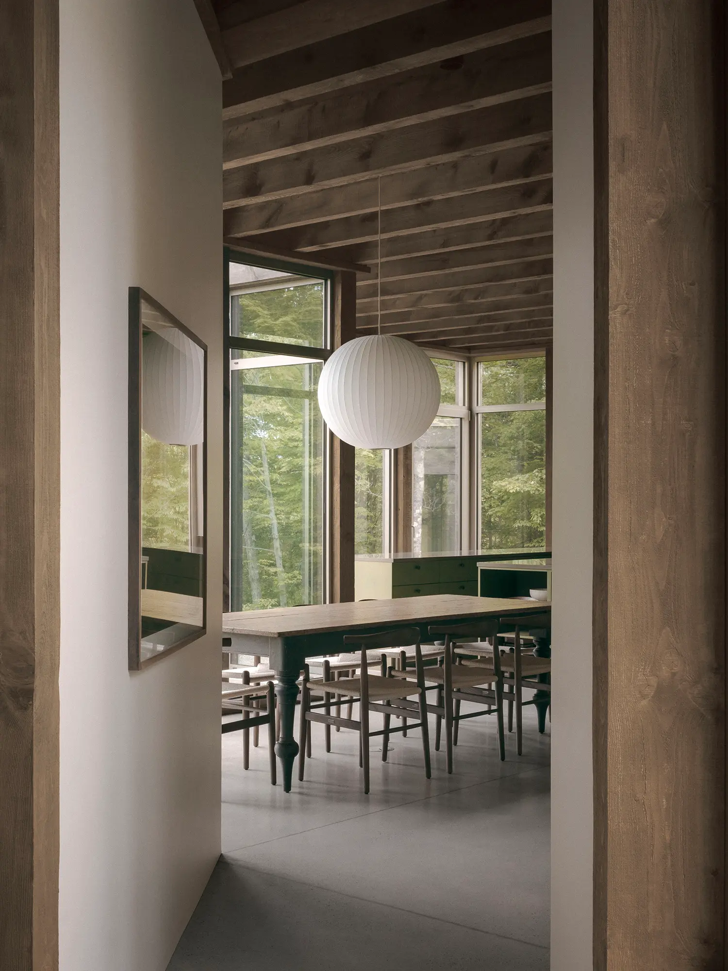 Atelier Carle SONO Residence dining room reclaimed timber ceiling full-height glazing corridor threshold Quebec 2025