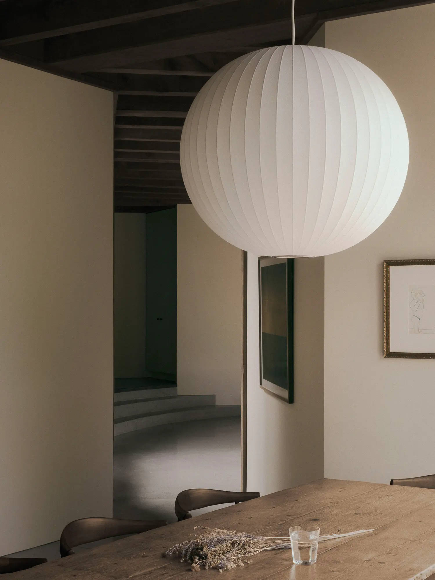 Atelier Carle SONO Residence Nelson pendant dining table terraced concrete stair doorway Quebec 2025