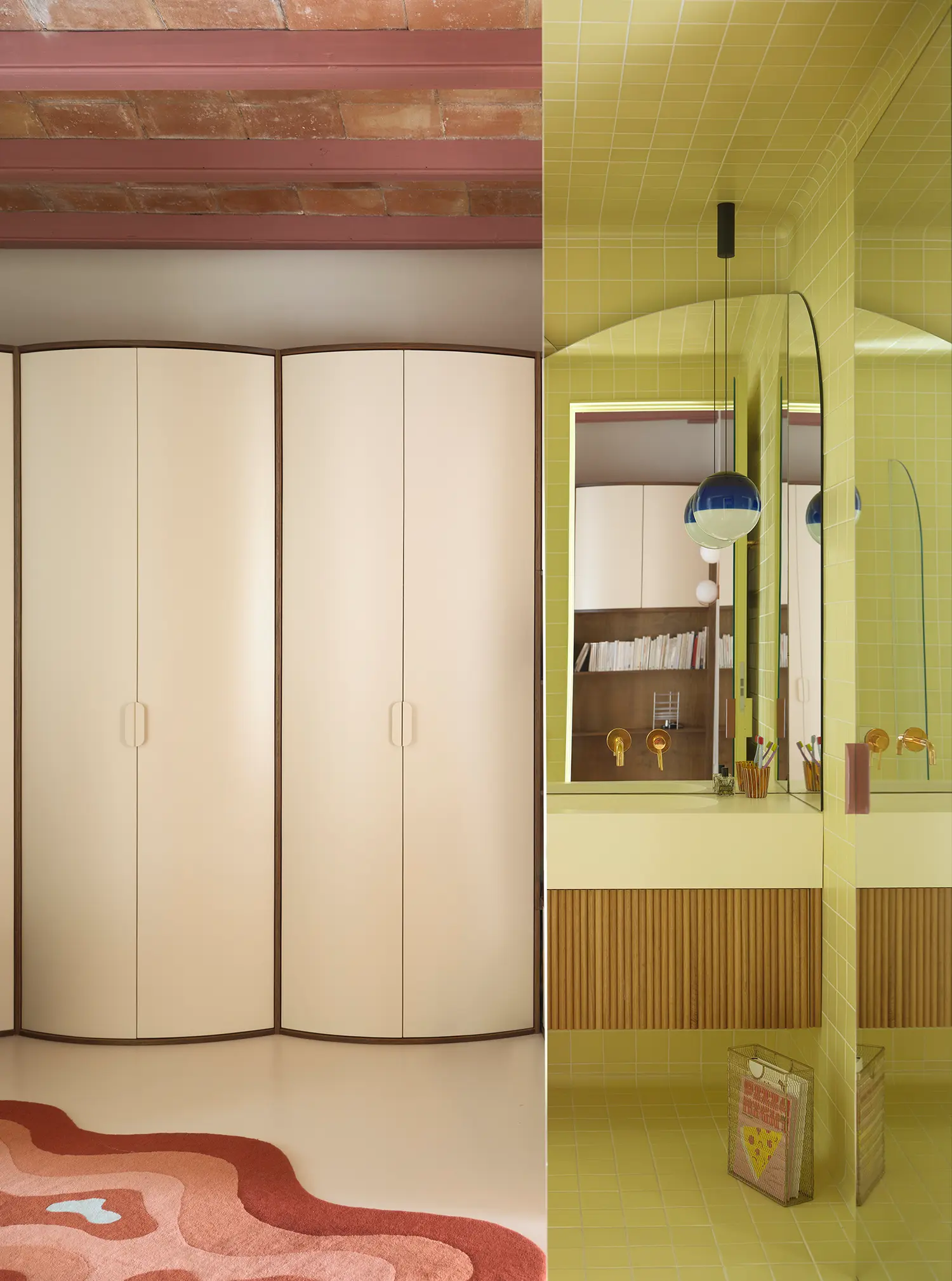 Split view showing a curved cream wardrobe unit and a vibrant yellow tiled bathroom with a fluted wood vanity.