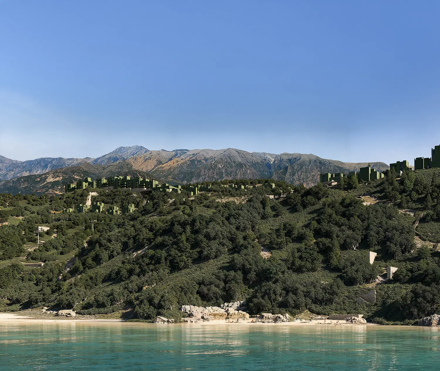 Wide shot of The Veil resort by Bofill Taller de Arquitectura integrated into the green hills of Dhërmi.