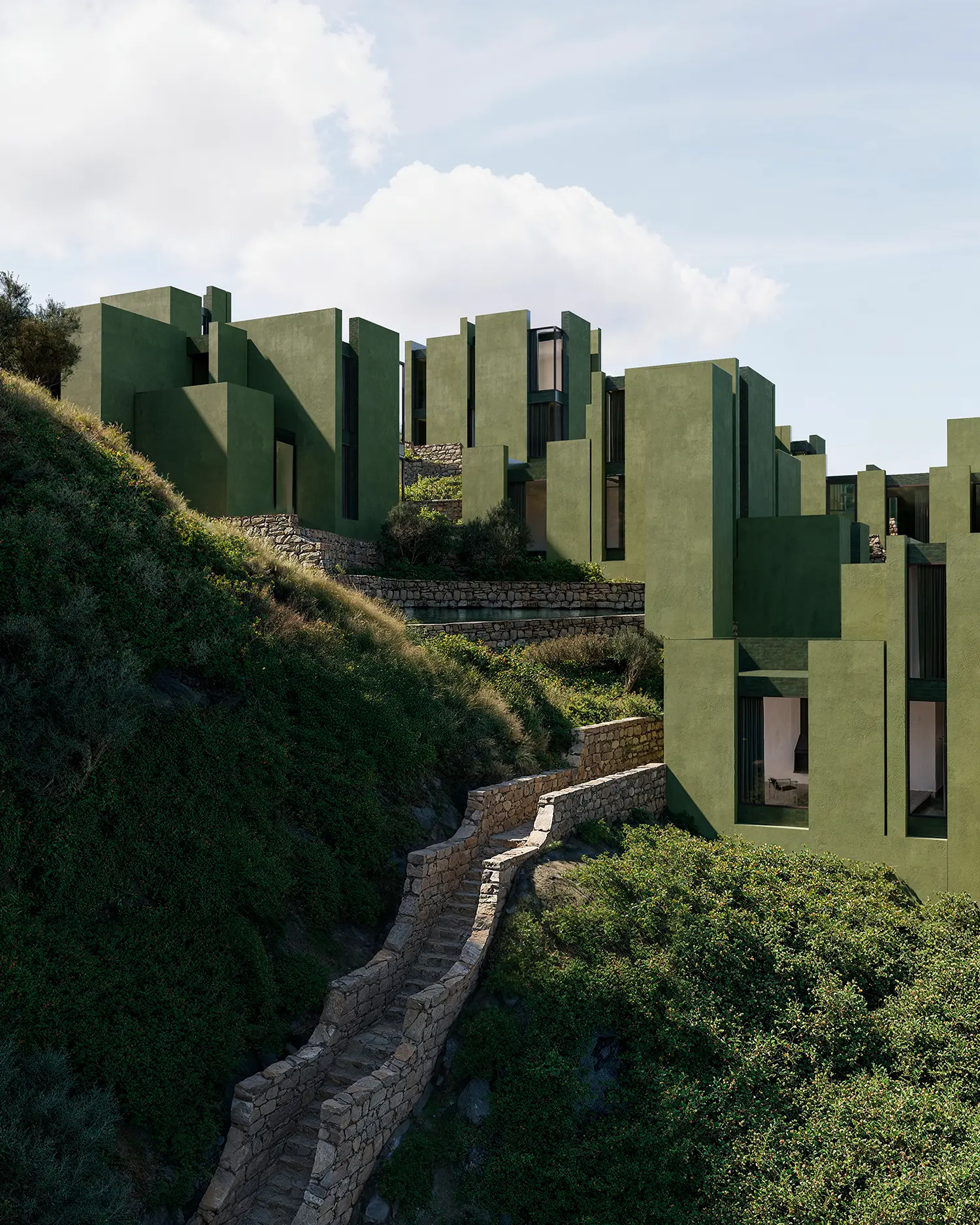 Stepped green villas and winding stone staircases at The Veil resort in Albania.