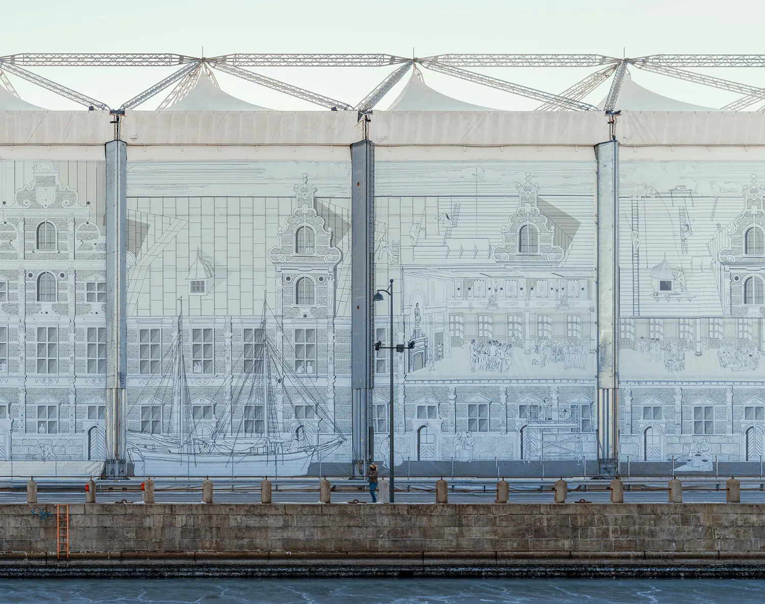 A wide-scale hand-drawn mural on a construction cover depicting the historical Børsen facade and maritime scenes, situated behind a stone canal wall.