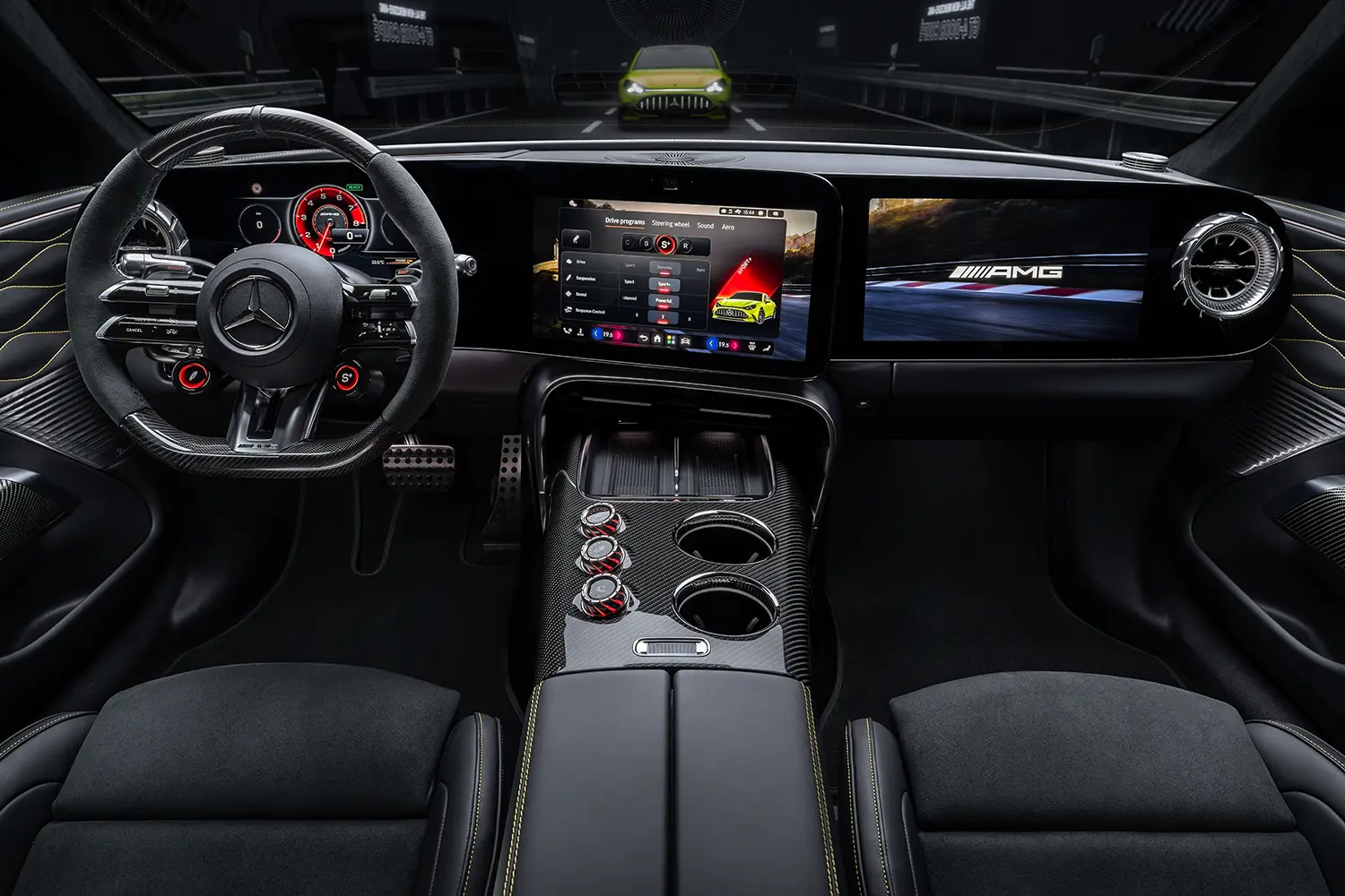 Close-up of a Mercedes-AMG steering wheel with integrated digital dial controls and carbon fiber trim detailing.