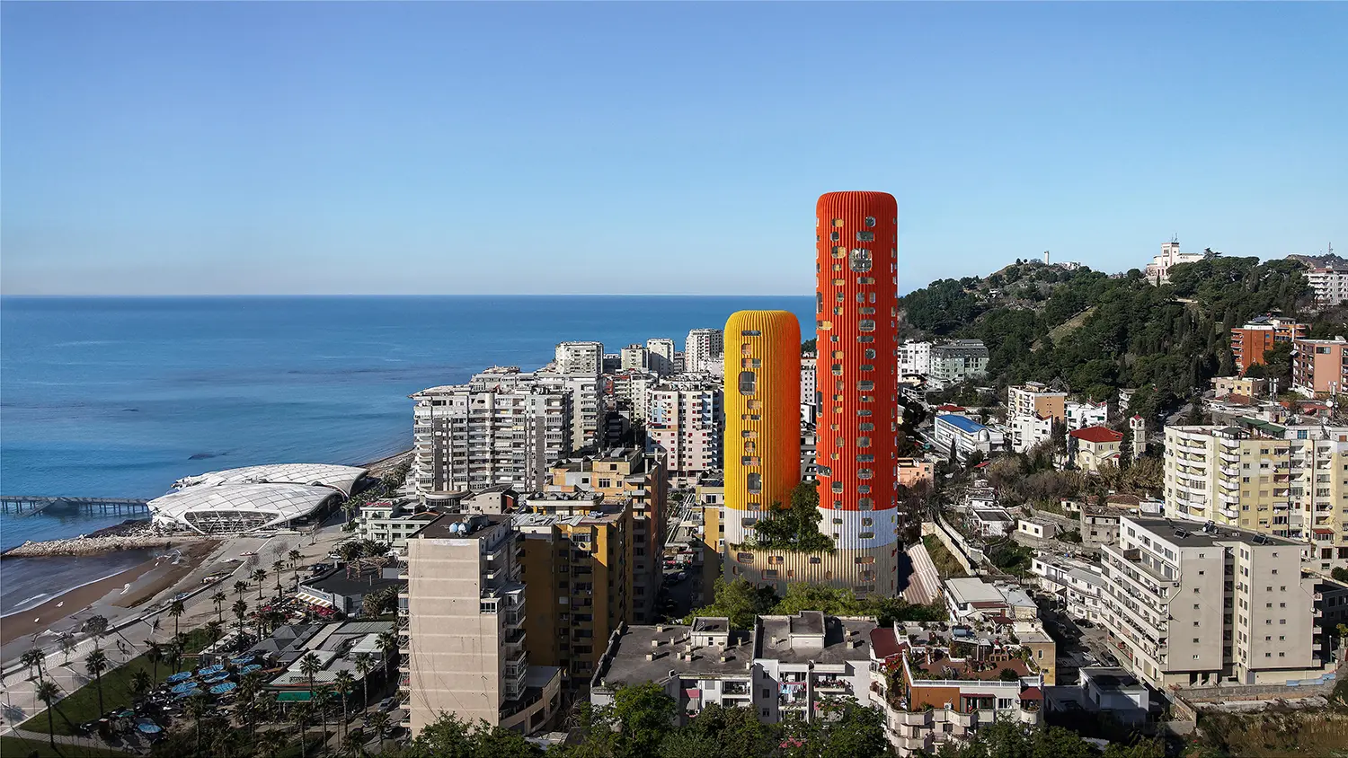 Aerial coastal view of the yellow and red Sky-K residential towers in the urban skyline of Durrës, Albania.