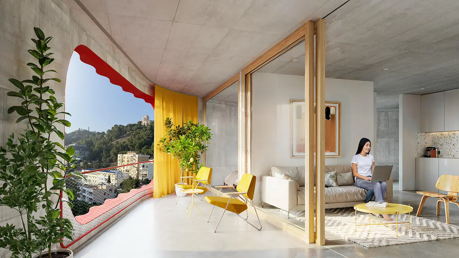 Spacious Sky-K living room with contemporary furniture and a terrace overlooking the city hills.