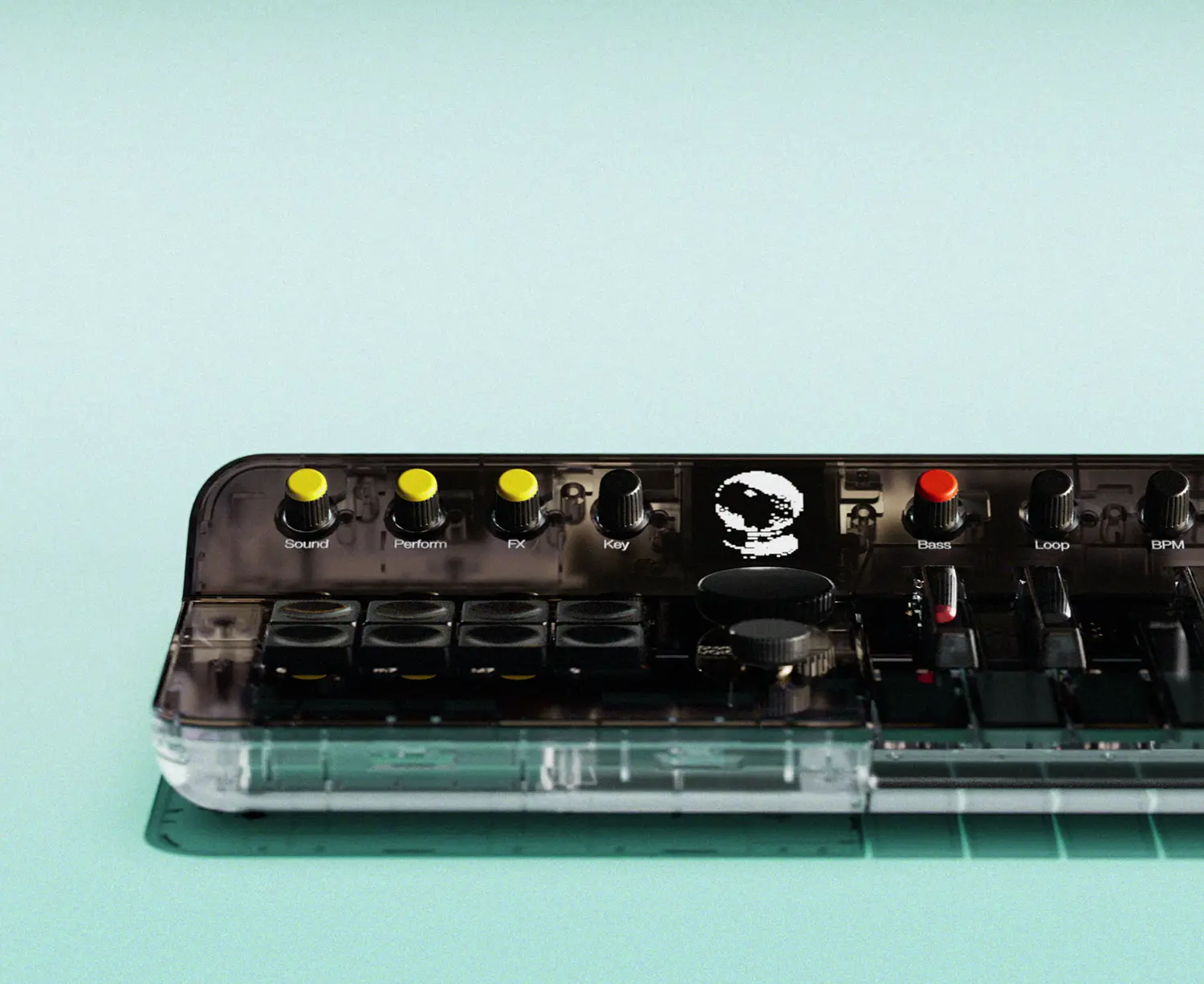 Front-facing close-up of the Clear Orchid: Arctic interface with yellow and red control knobs and a pixelated display.