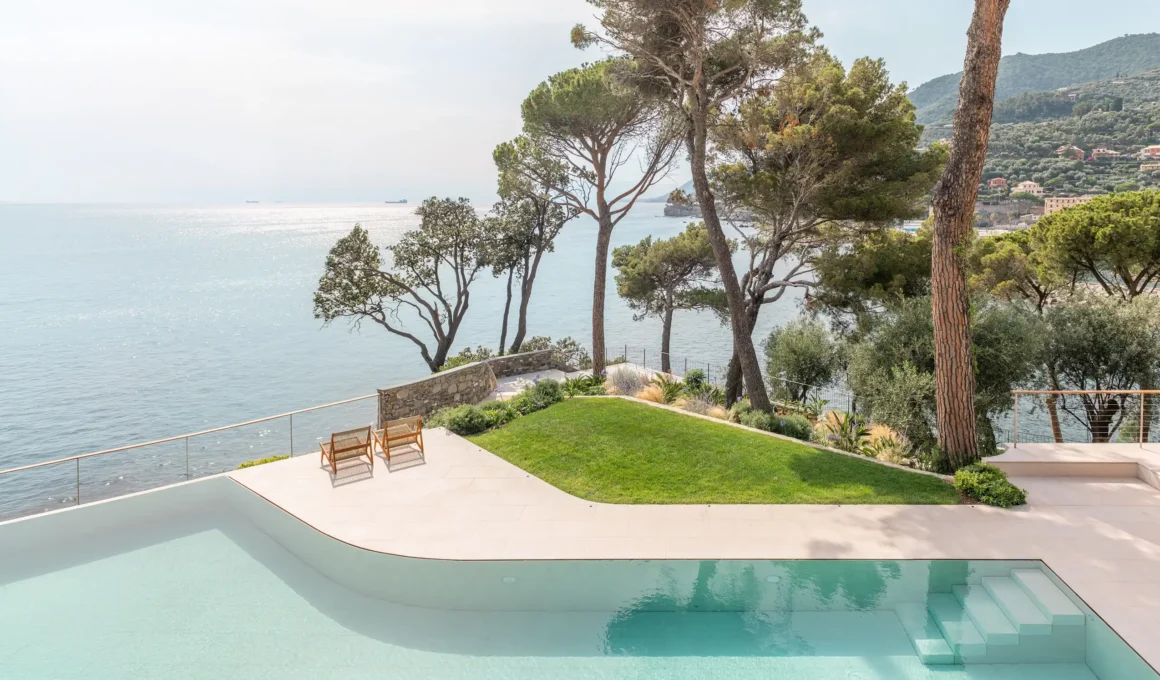 Villa in Recco by Gosplan Giordano Hadamik Architects caarpa studio.skey, disappearing pool Botticino marble surround, maritime pines, Ligurian coastline Recco
