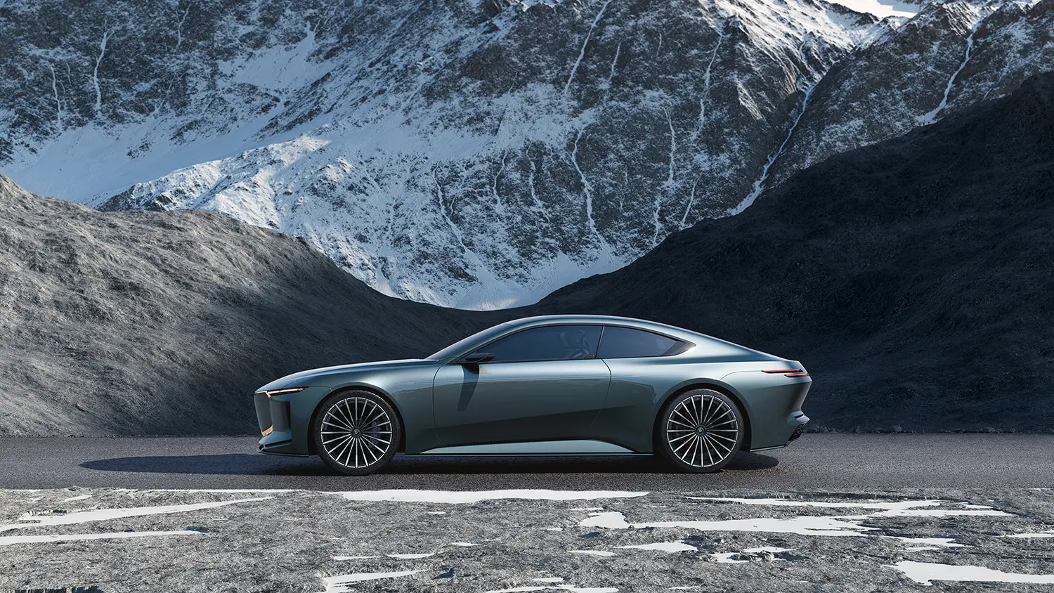 Clean studio side profile view of the metallic gray luxury grand tourer concept car against a snowy mountain backdrop.