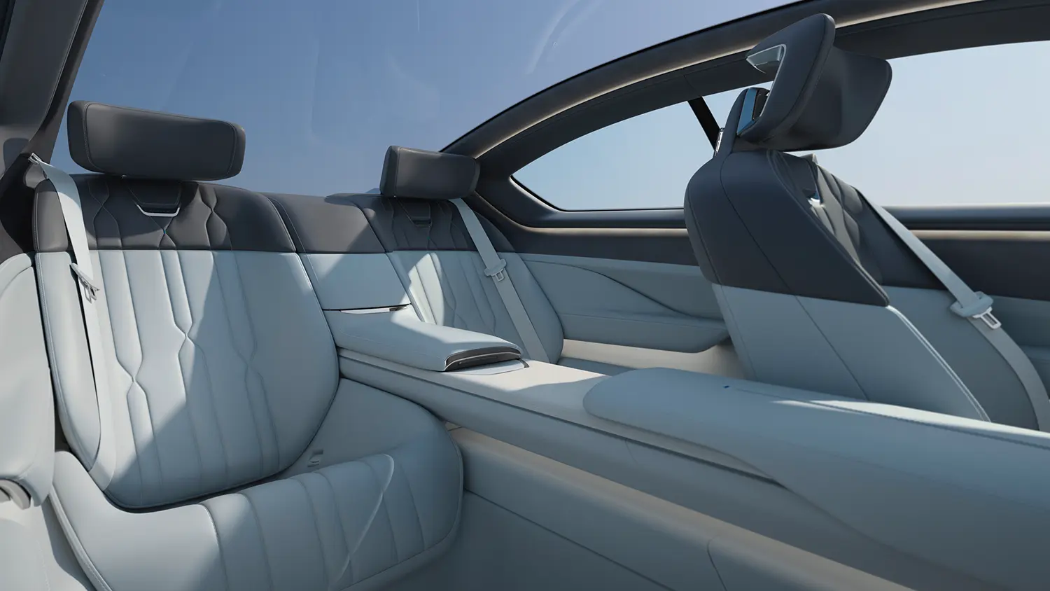 Rear passenger compartment of the luxury coupe showing two-tone leather seats and a continuous center console.
