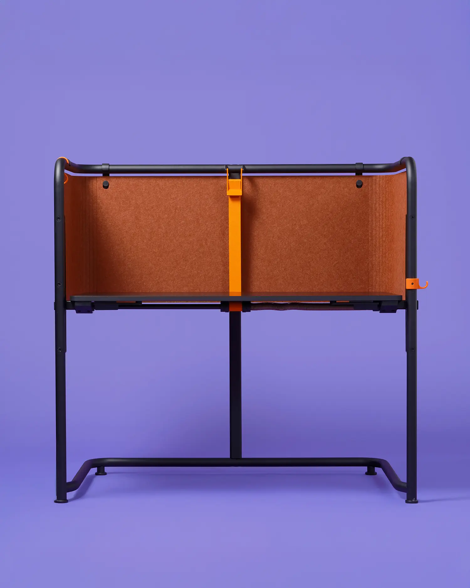 Front view of a Scout desk with a black top, dark grey frame, and orange-brown privacy screens.