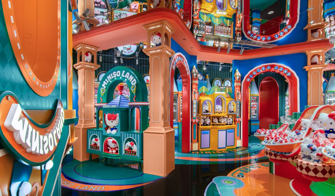 Whimsical interior of MINISO LAND Guangzhou flagship by X+Living featuring arched doorways, warm orange columns, and character displays.