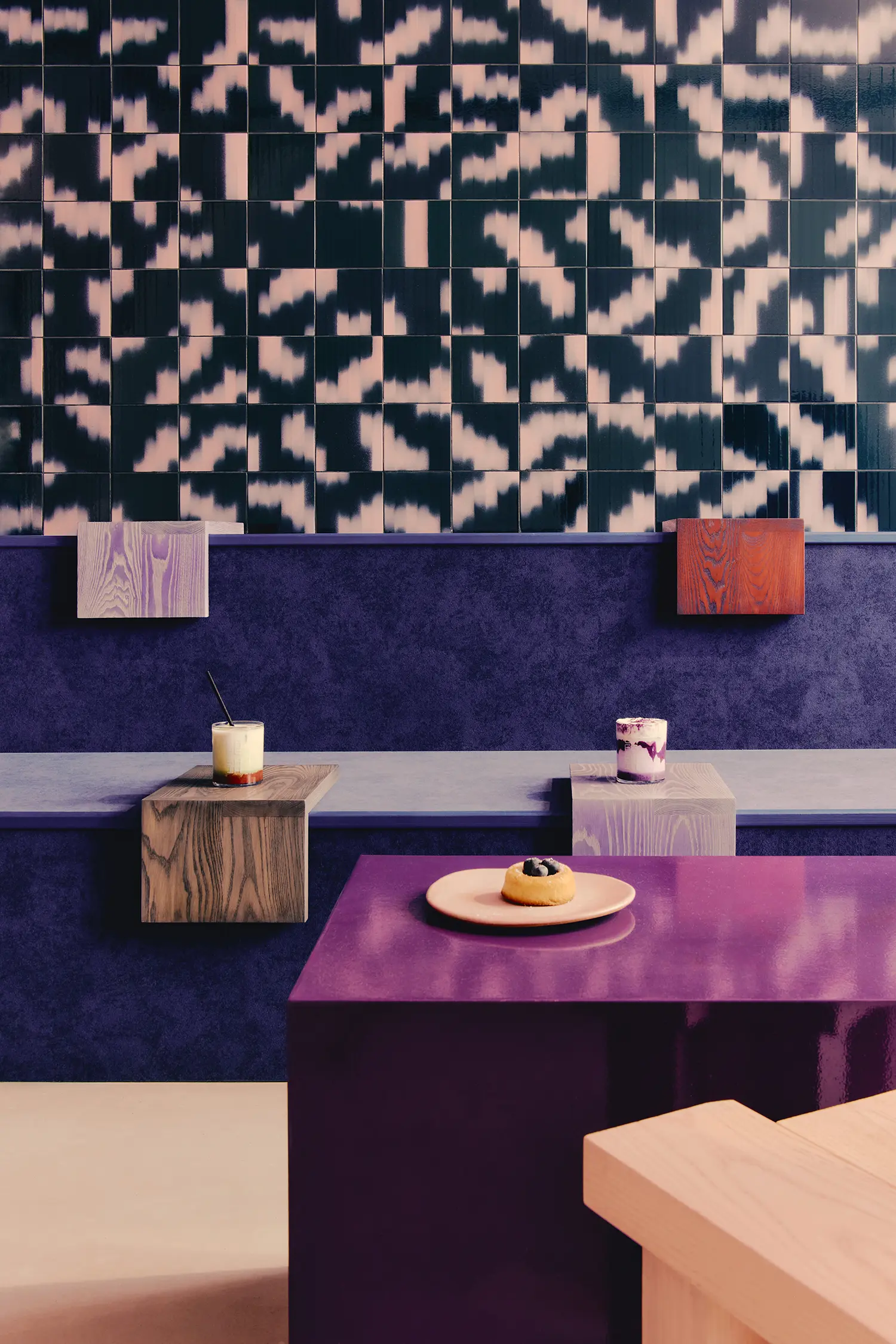 Café Shin Marais Uchronia Paris screening room Palet ikat tiles purple platform stained wood side tables Korean pastries