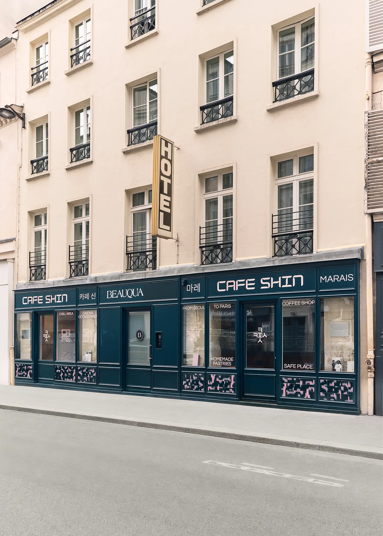 Café Shin Marais Uchronia Paris exterior full facade rue de Turenne dark teal joinery Hotel sign bilingual signage