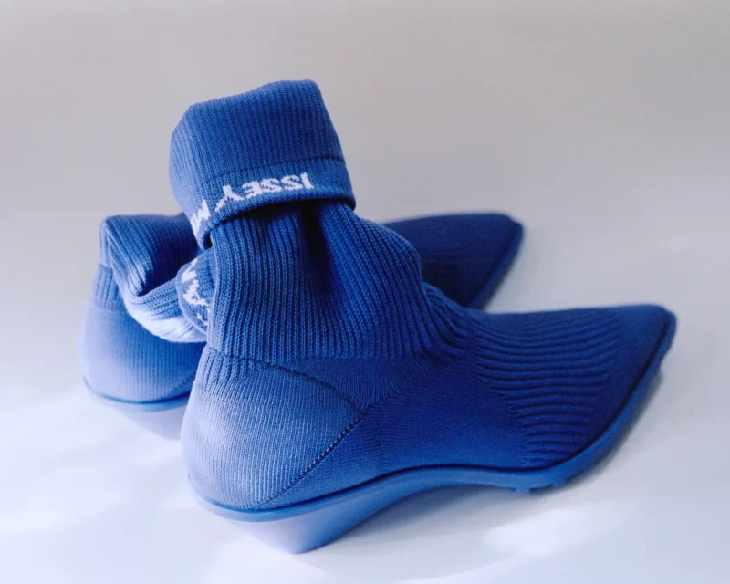 Camper x Issey Miyake Anna boot in blue TENCEL knit, rear view showing folded cuff with woven Issey Miyake logo