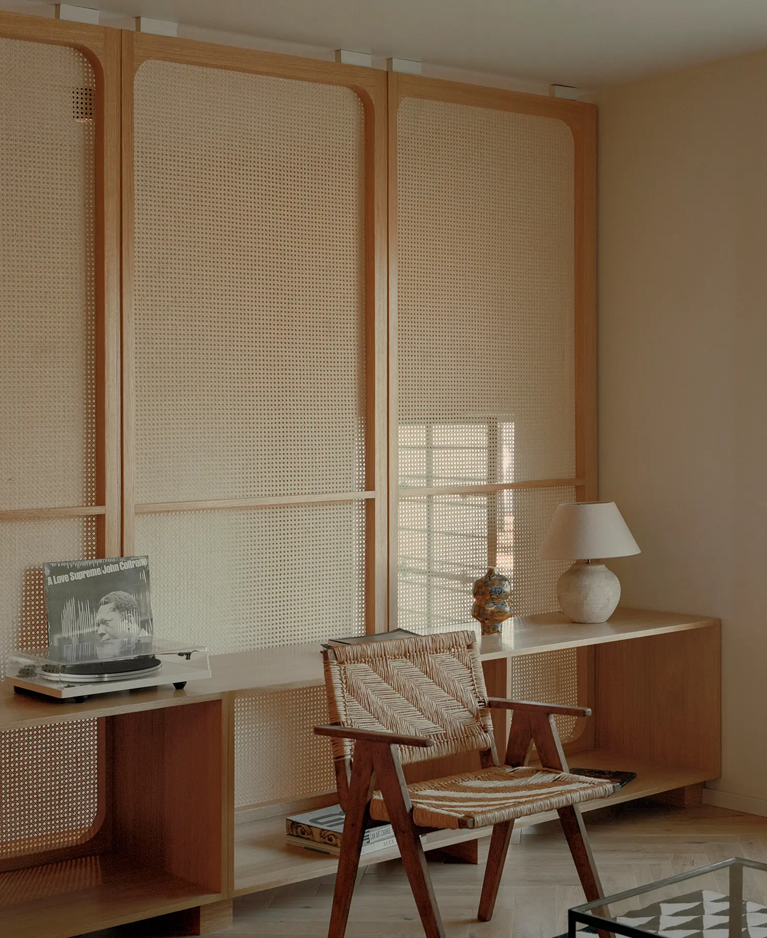 Casa Xoltic AMASA Estudio, first floor room with floor-to-ceiling oak and cane millwork panels, custom wood shelving, Coyoacán Mexico City
