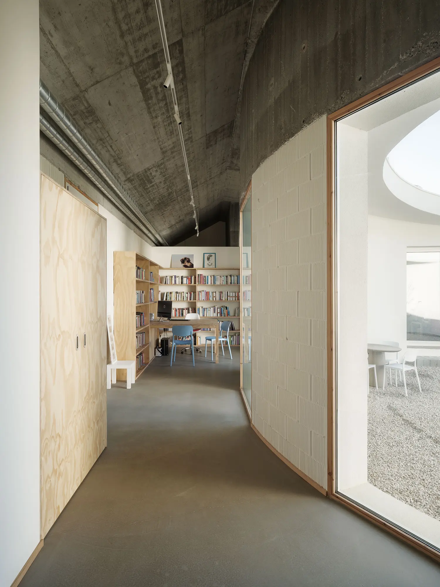 Cecebre House Sinaldaba Galicia corridor plywood doors cellular block curved wall courtyard library