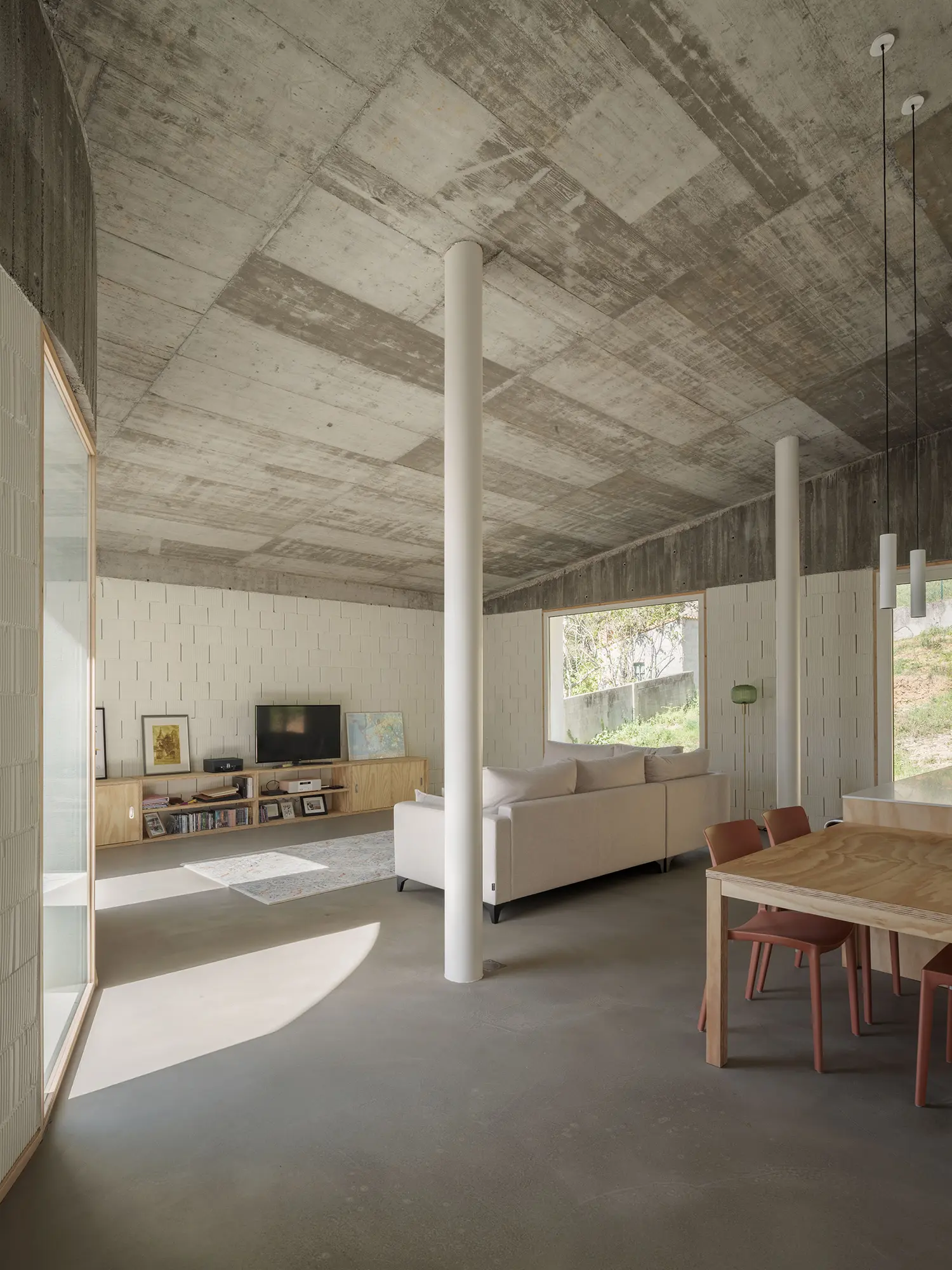 Cecebre House Sinaldaba Galicia living room exposed concrete ceiling columns south light