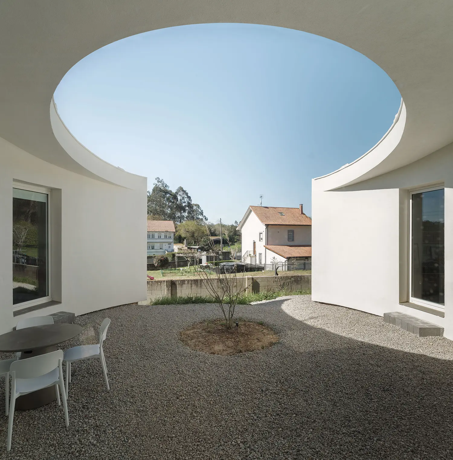 Cecebre House Sinaldaba Galicia courtyard circular oculus sky Cecebre village rendered masonry