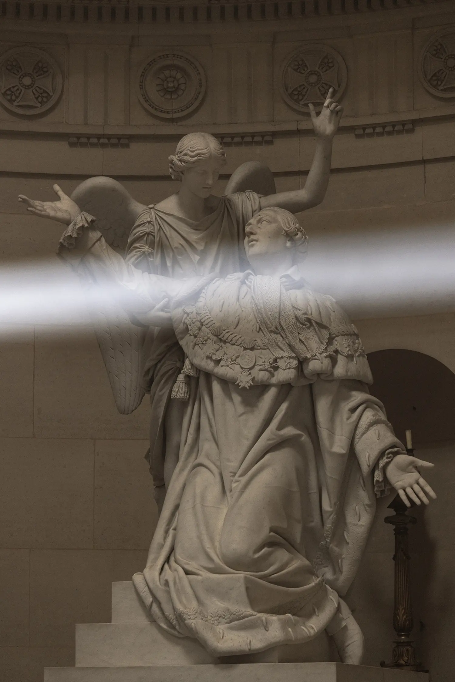 Threshold Emilio Ferro, white light beam crossing marble sculpture of angel and kneeling figure, Chapelle Expiatoire Paris 2026