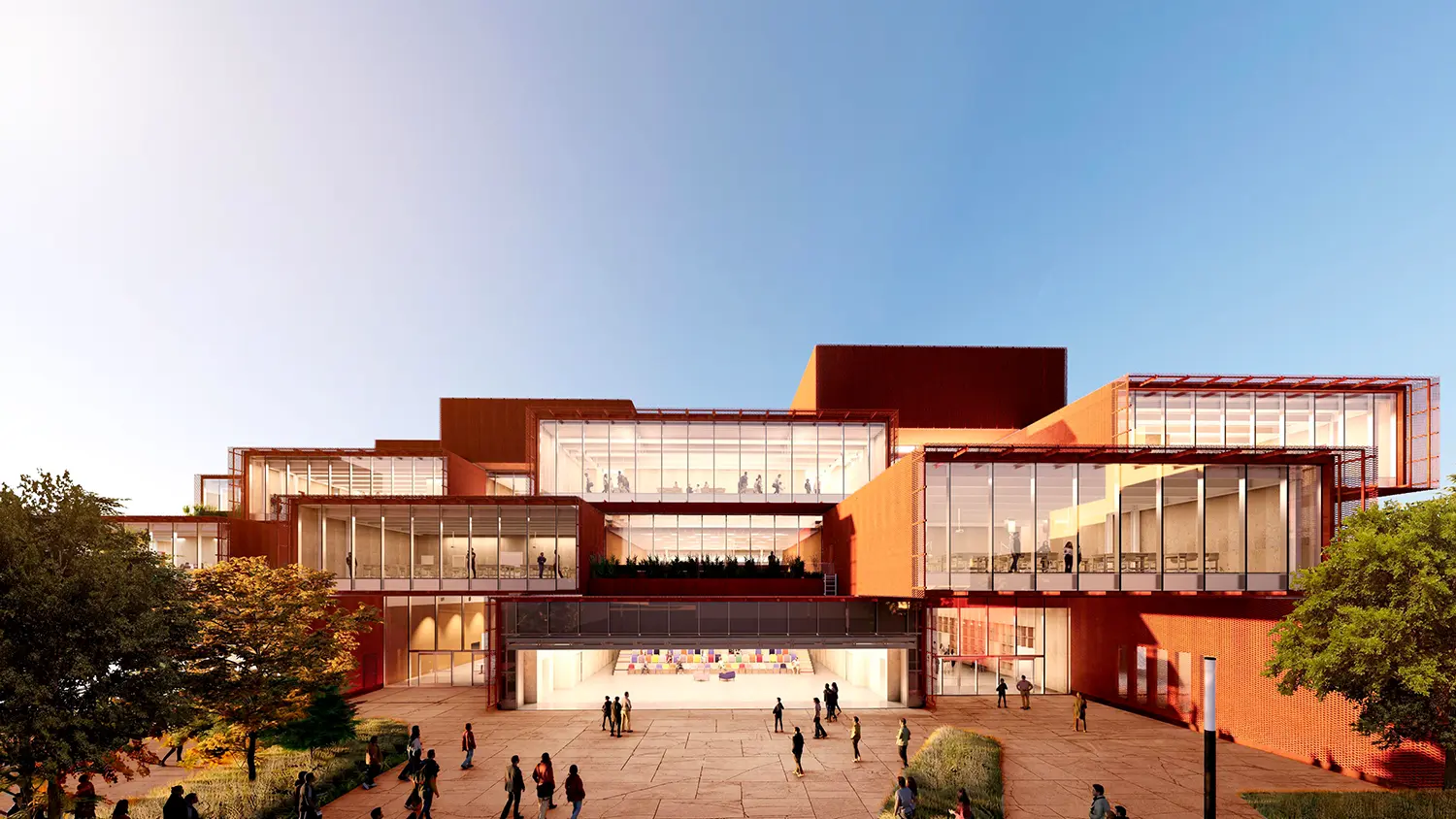 BIG STEM university Bentonville makerspace interior ground floor open facade Corten steel evening