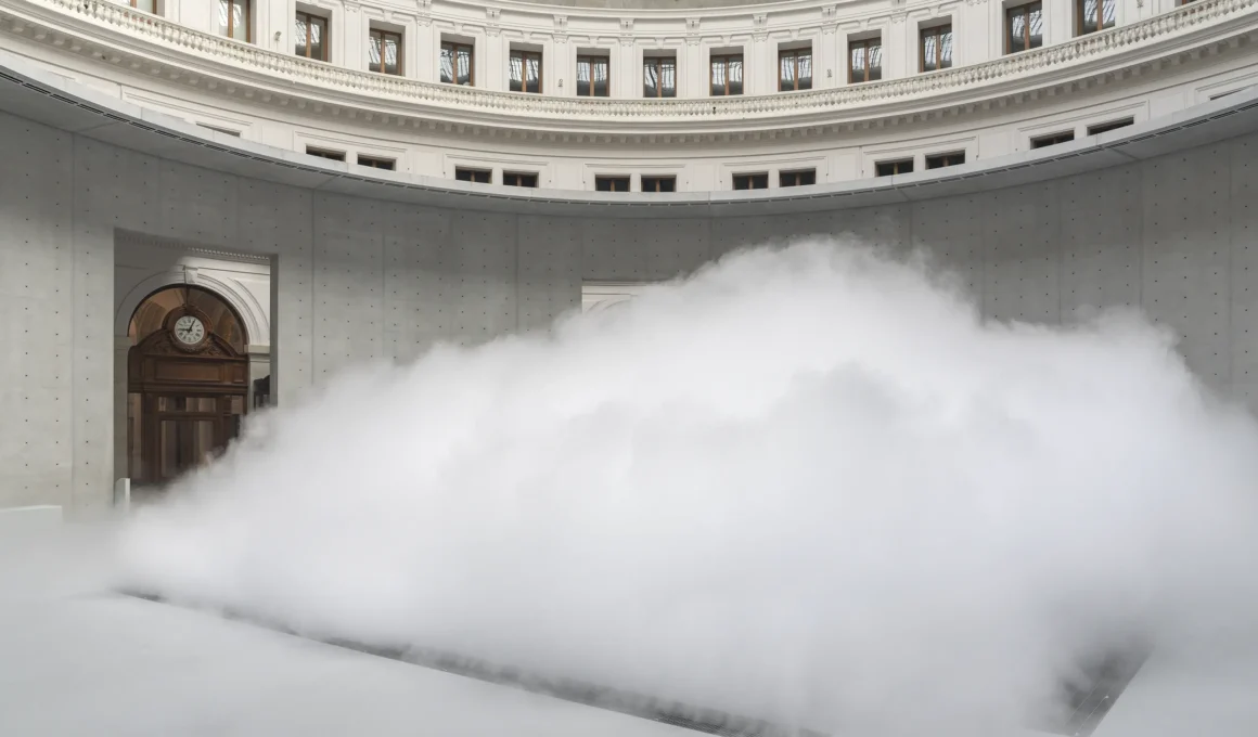 Fujiko Nakaya Cloud #07156 Bourse de Commerce Paris, fog sculpture filling Rotonde floor, Tadao Ando concrete cylinder walls, ornate arcade above