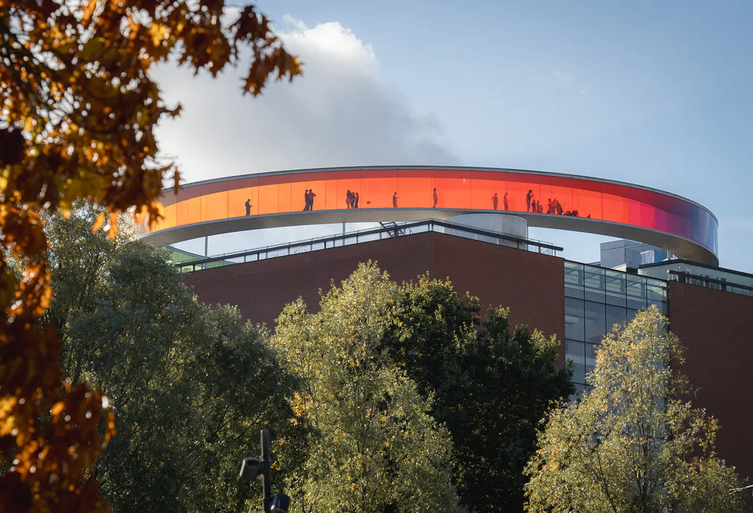 ARoS Aarhus rooftop Olafur Eliasson Your Rainbow Panorama glass ring autumn visitors silhouettes