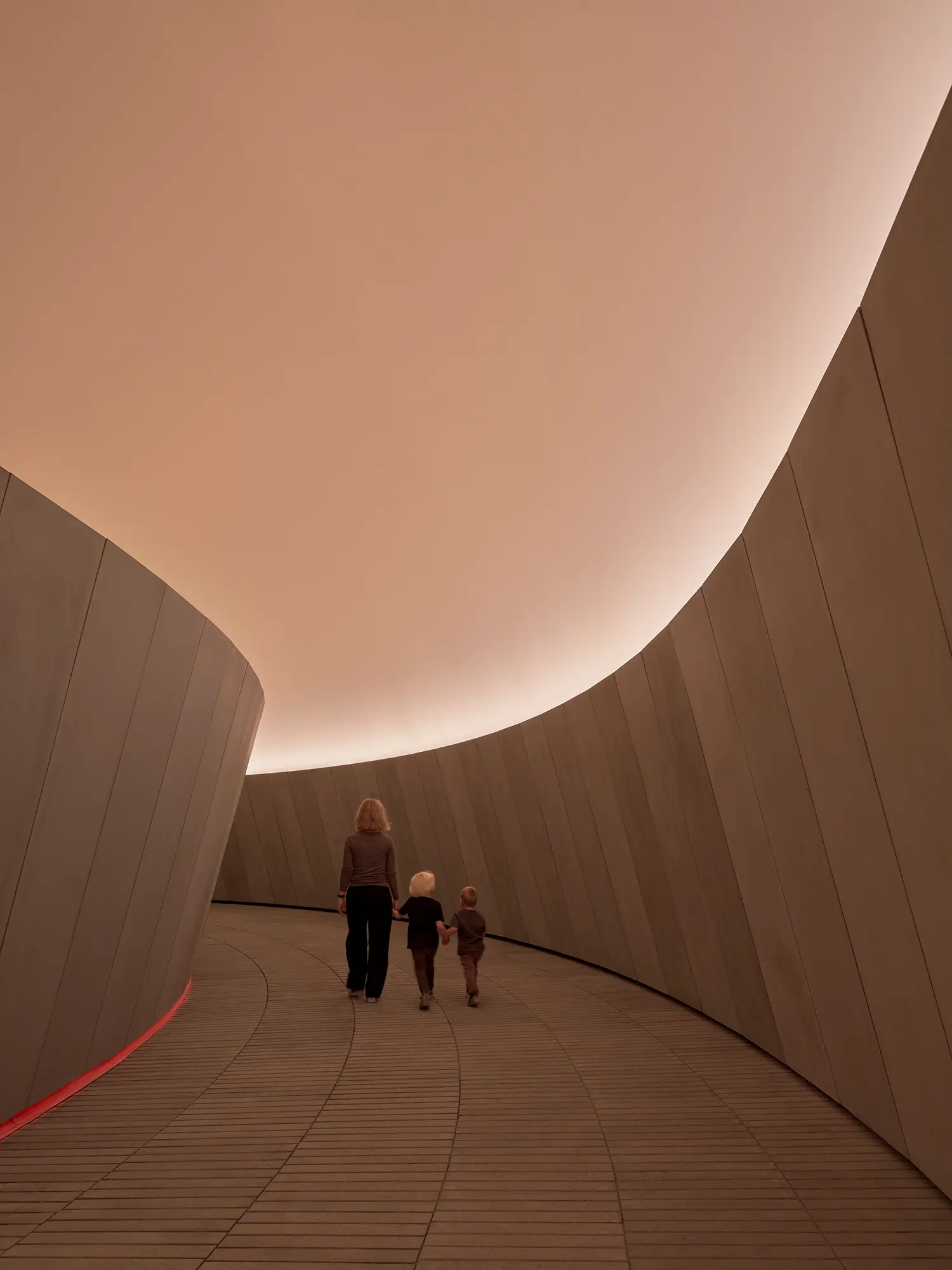 James Turrell As Seen Below underground corridor ARoS Aarhus curved concrete warm ambient light family visitors