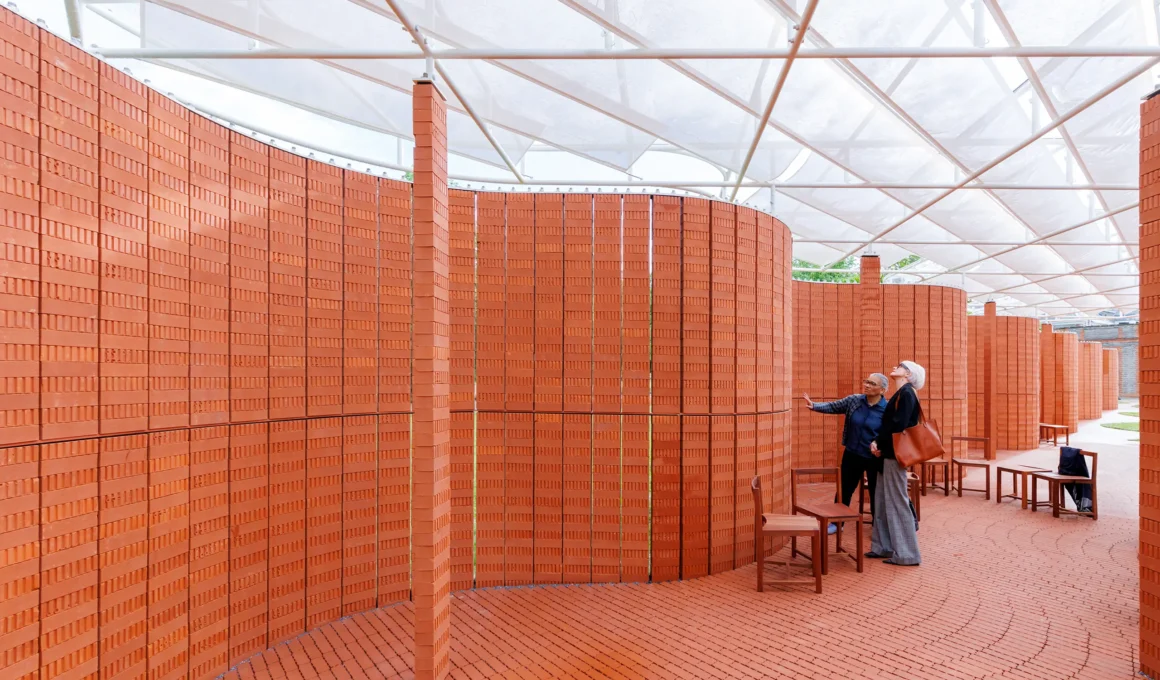 Serpentine Pavilion 2026 by LANZA atelier interior view curved Sienna brick wall translucent roof Kensington Gardens London