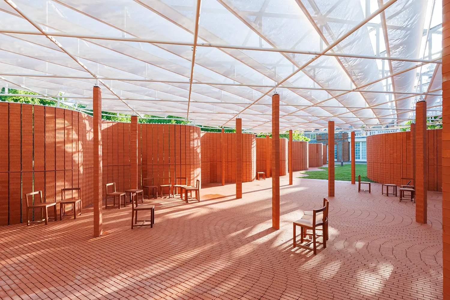 Serpentine Pavilion 2026 by LANZA atelier interior brick columns translucent roof sapele chairs Kensington Gardens