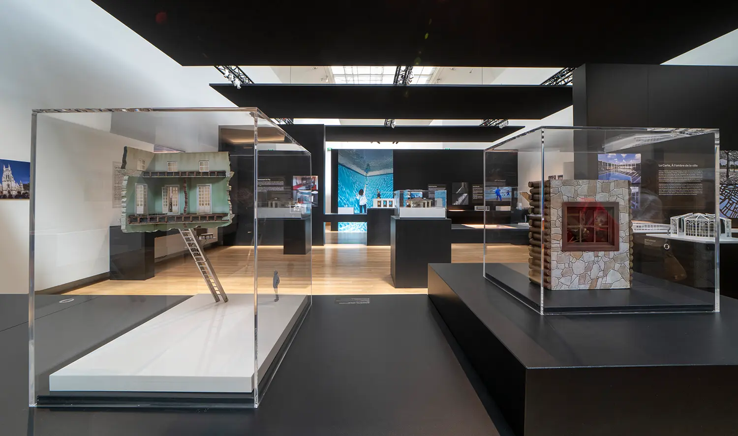 Leandro Erlich Documentation Room Grand Palais Paris, architectural scale models under plexiglass, section-cut house and stone fragment with window