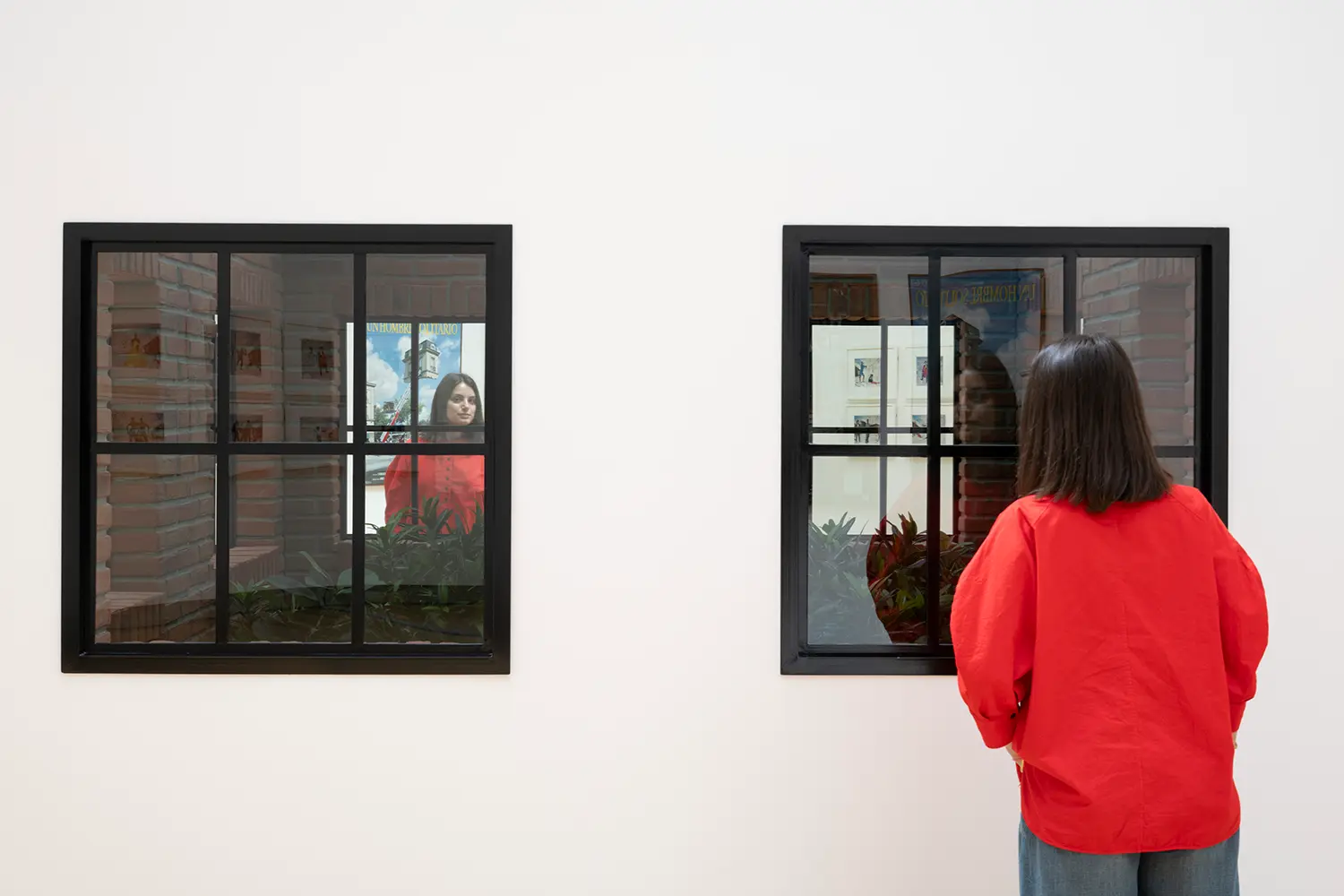 Leandro Erlich window installation Grand Palais Paris, two black-framed windows with printed exterior view, visitor's reflection in glass pane
