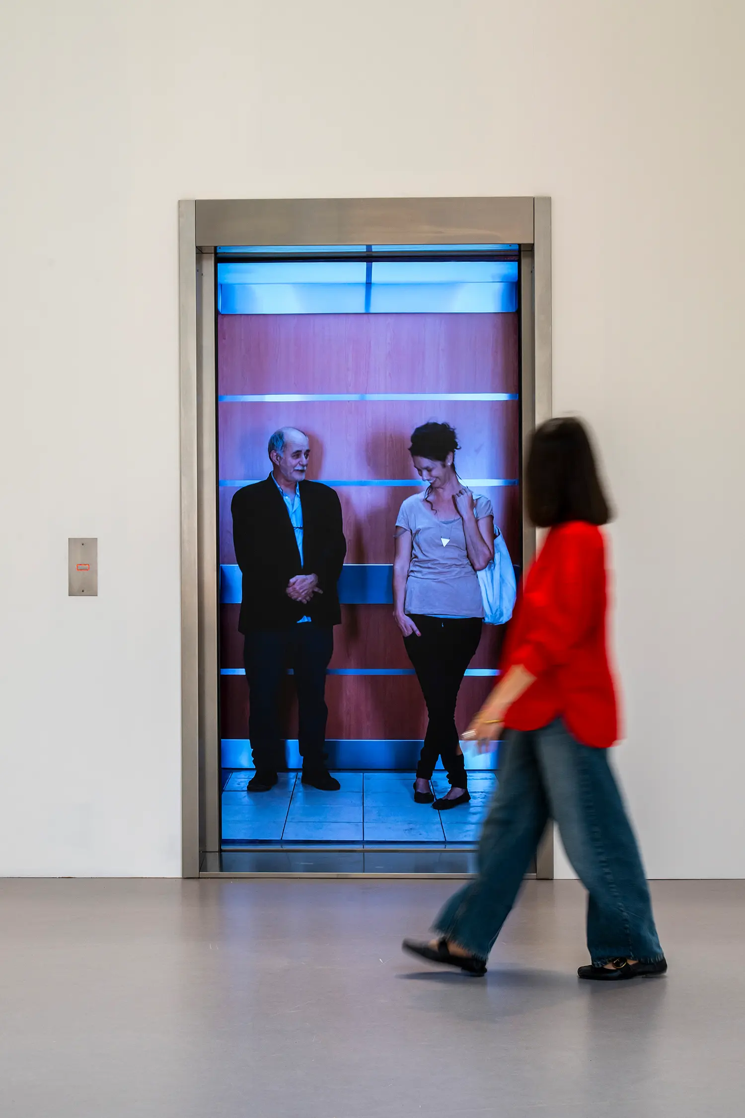 Leandro Erlich Elevator Maze Grand Palais Paris, open stainless steel elevator door, video projection of two standing figures, call button panel