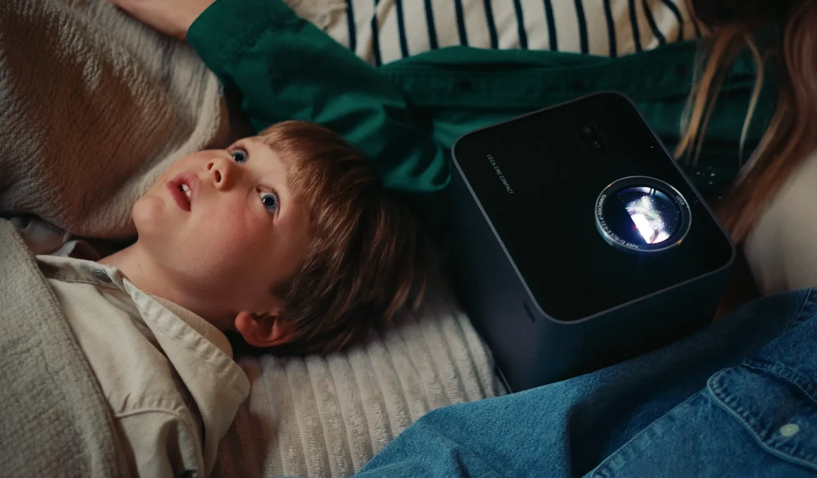 Leica Cine Compact 1 mini projector lifestyle use child watching ceiling projection indoors