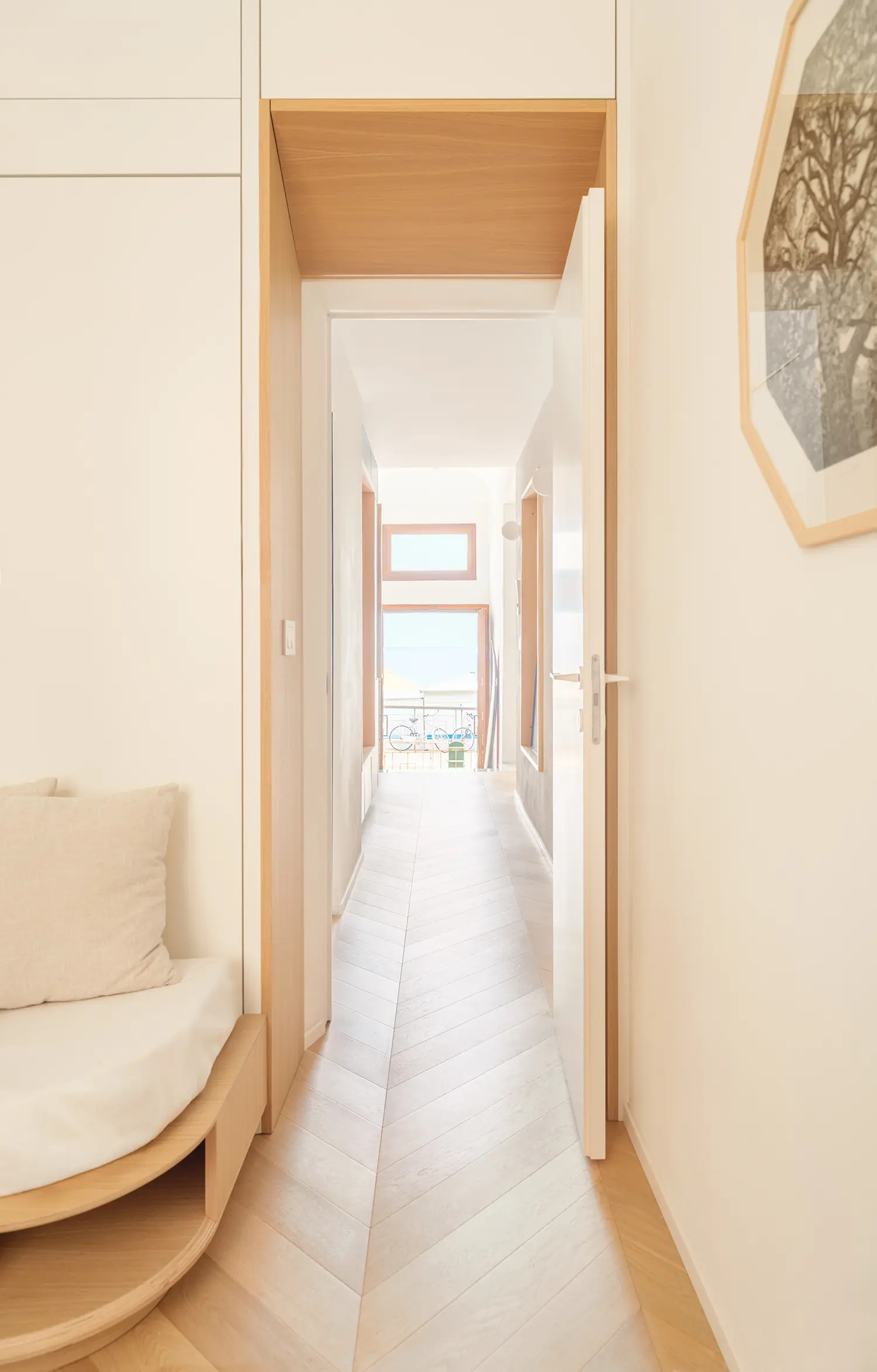 llabb Surf House Levanto corridor oak-lined threshold curved bench herringbone parquet sea view end