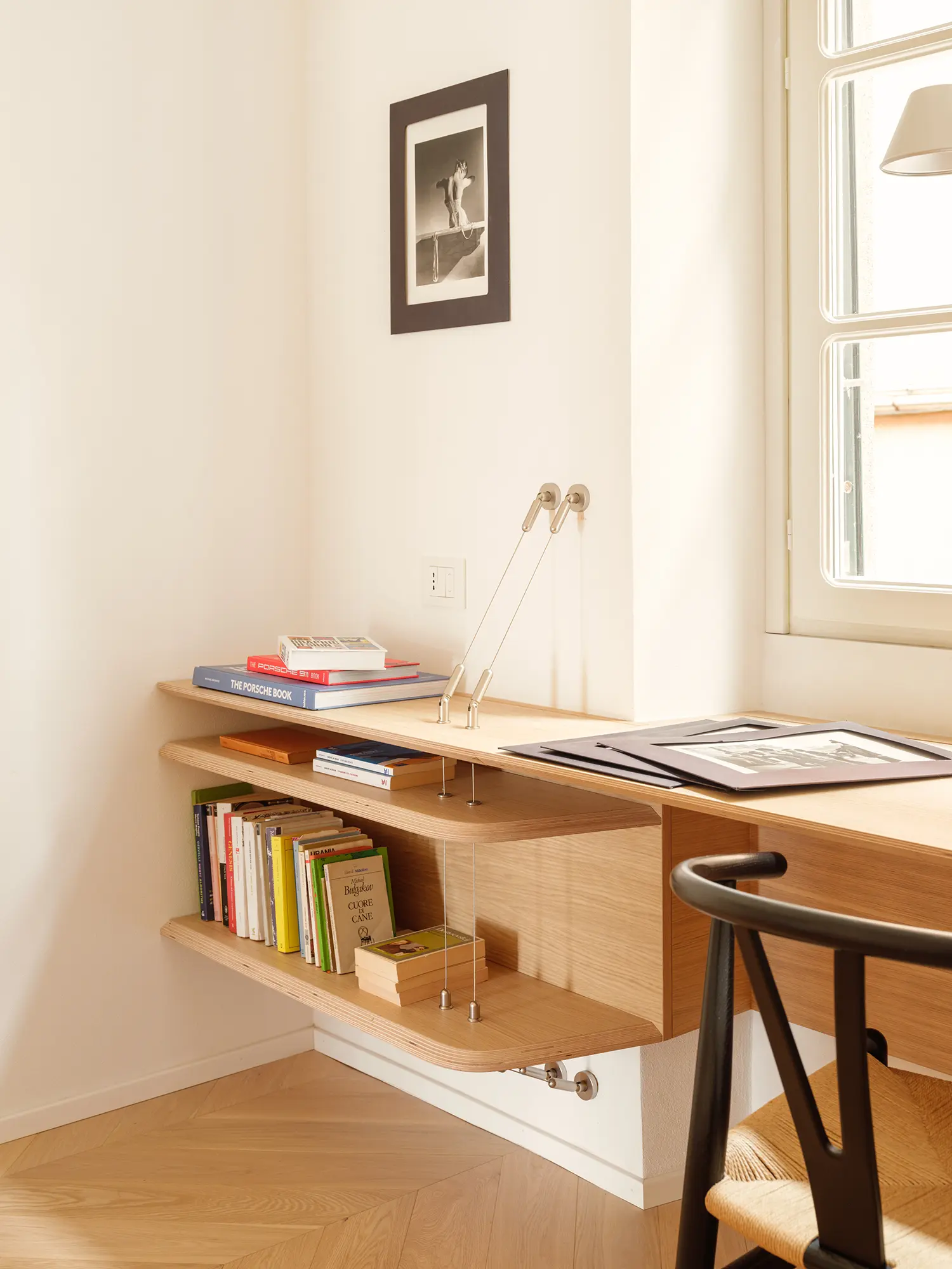 llabb Surf House Levanto study guest room oak desk bookshelf plywood edge tension rod shelf system herringbone parquet