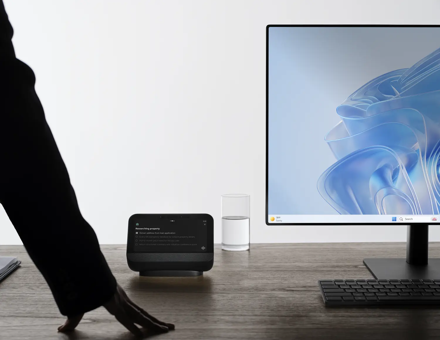 Microsoft Project Solara desk concept device on wooden desk next to monitor Windows 11 silhouette agent interface
