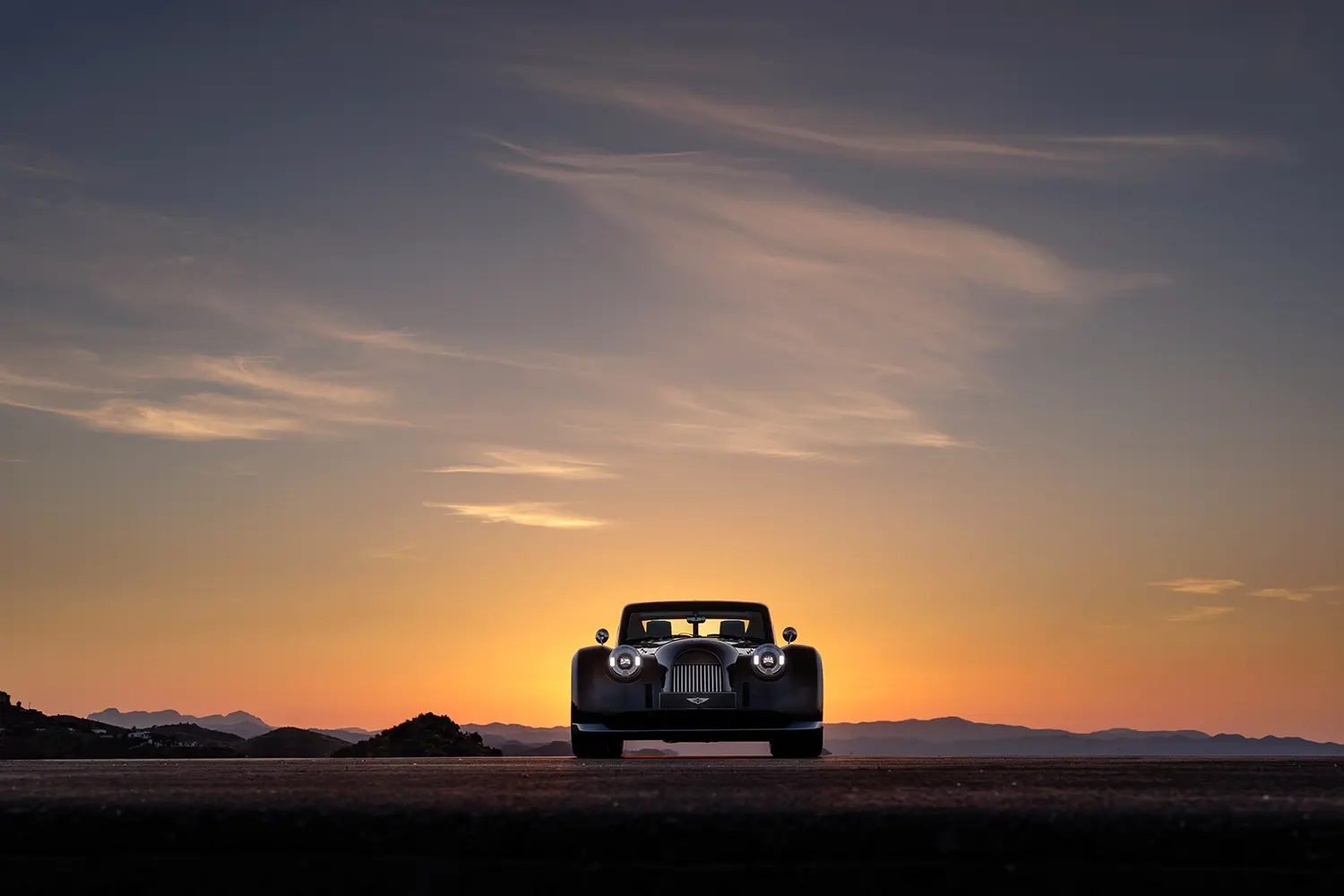 Morgan Midsummer Coupé Pininfarina front view sunset silhouette coachbuilt commission