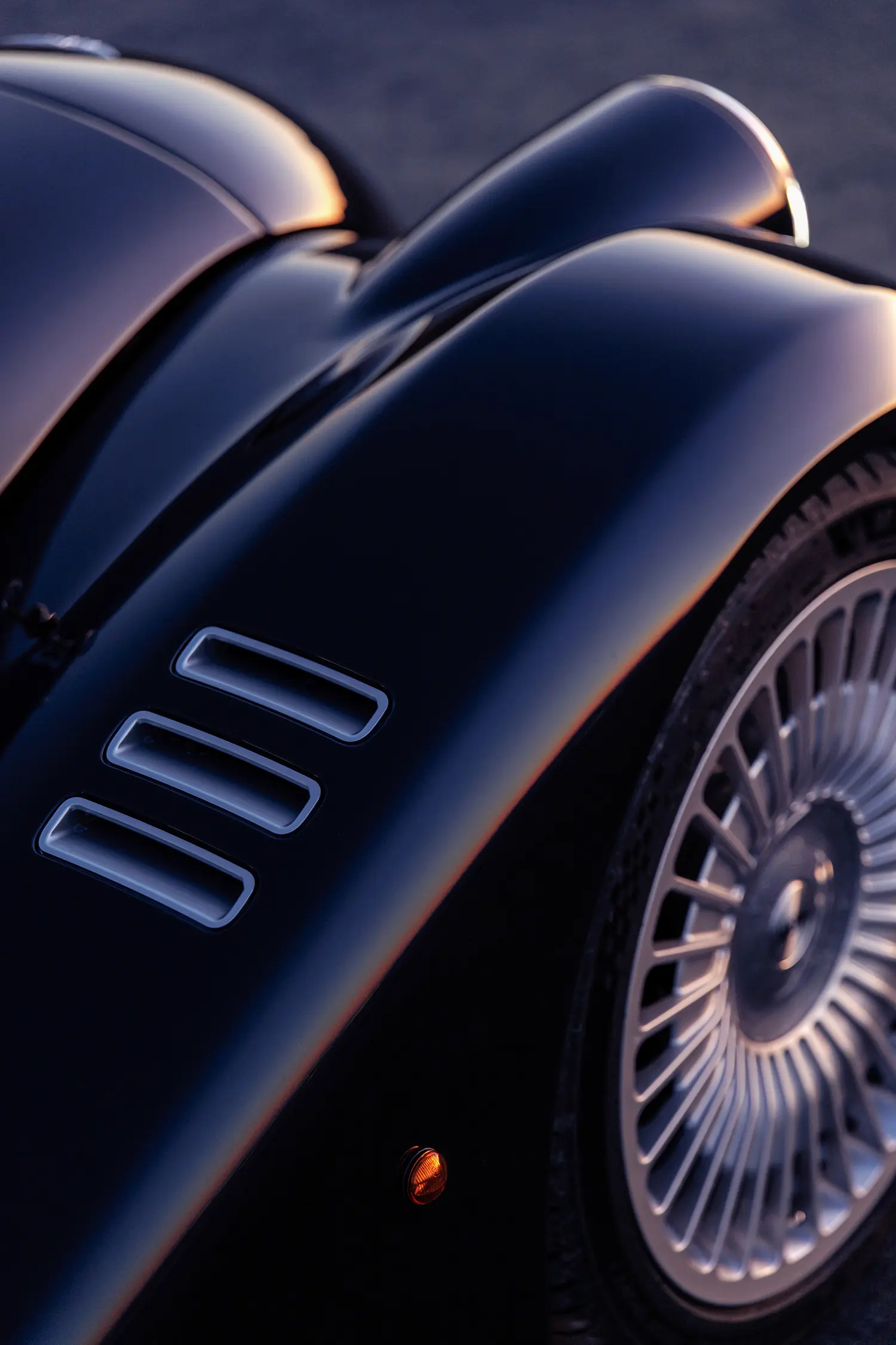 Morgan Midsummer Coupé hand-formed aluminium louvres forged wheel close-up detail