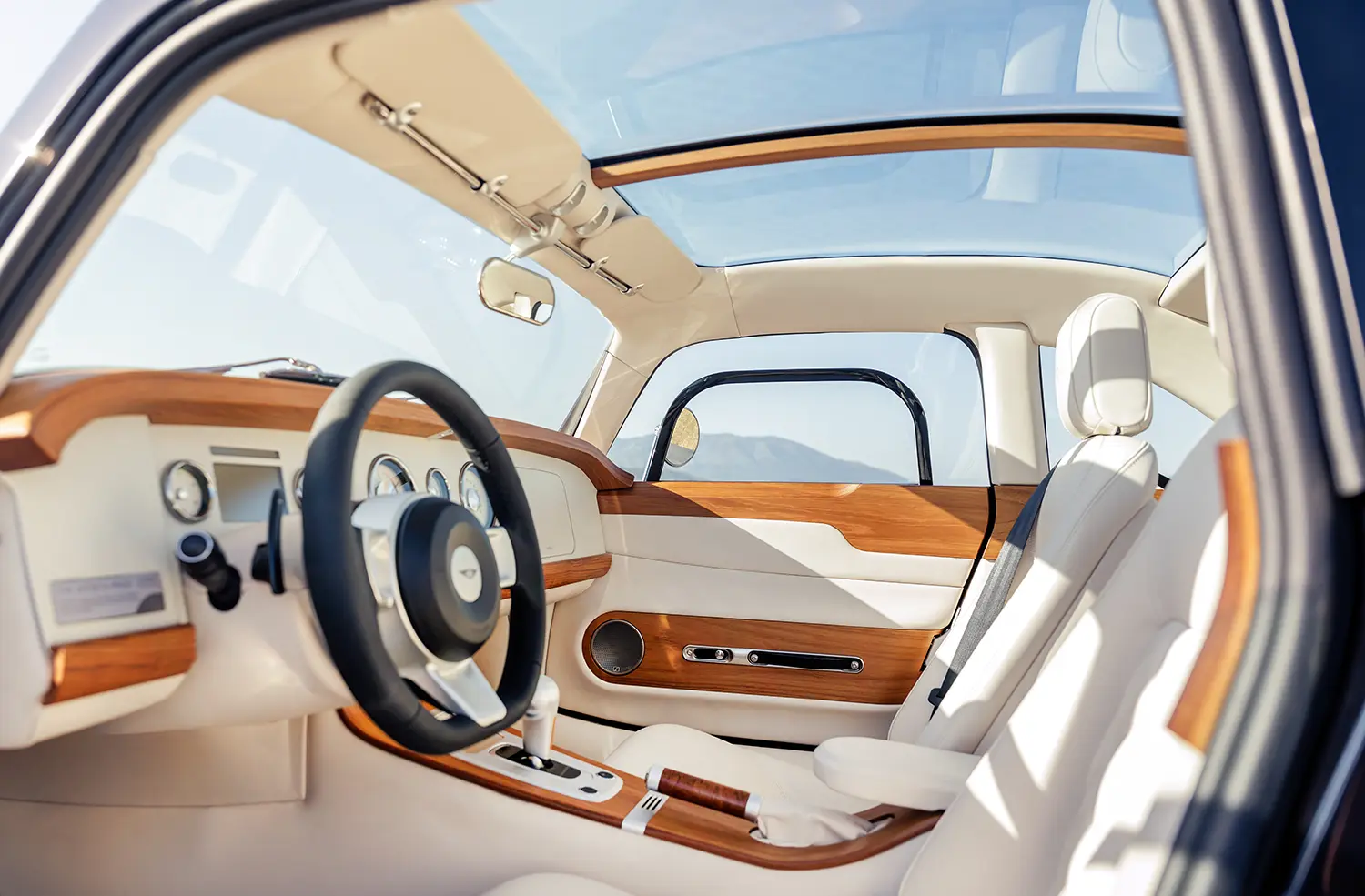 Morgan Midsummer Coupé interior teak dashboard white leather glazed roof cabin
